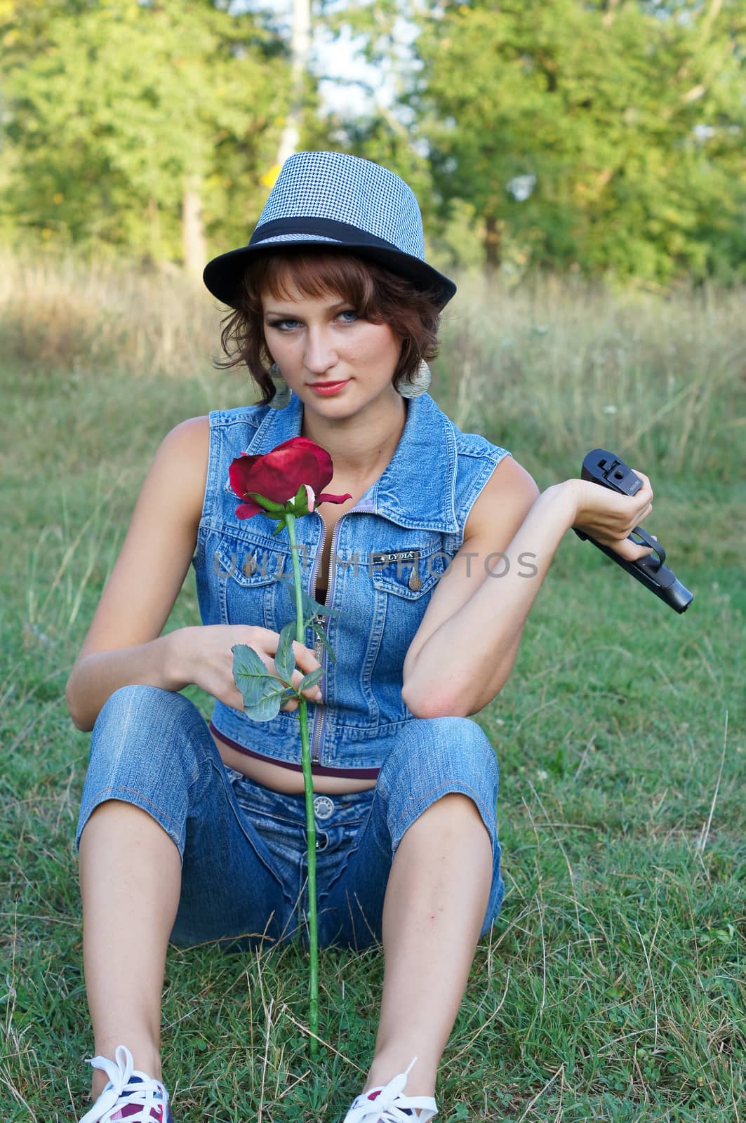 girl with gun on nature