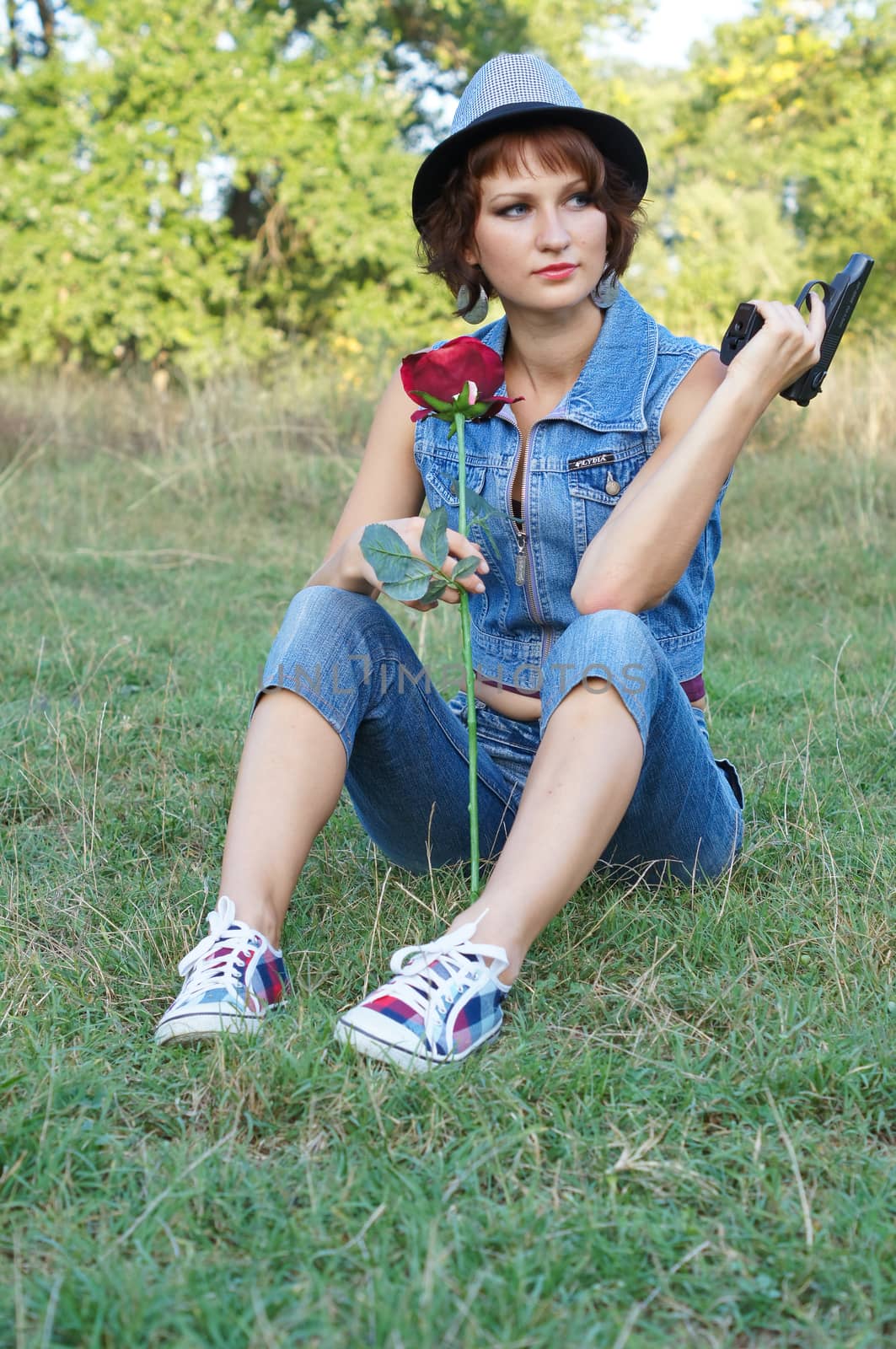 girl with gun on nature