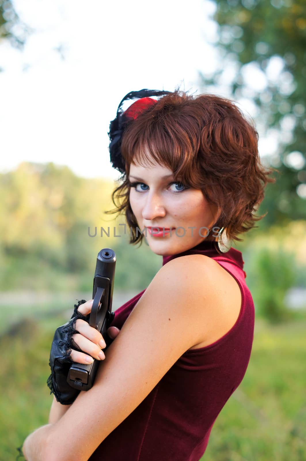 girl with gun on nature