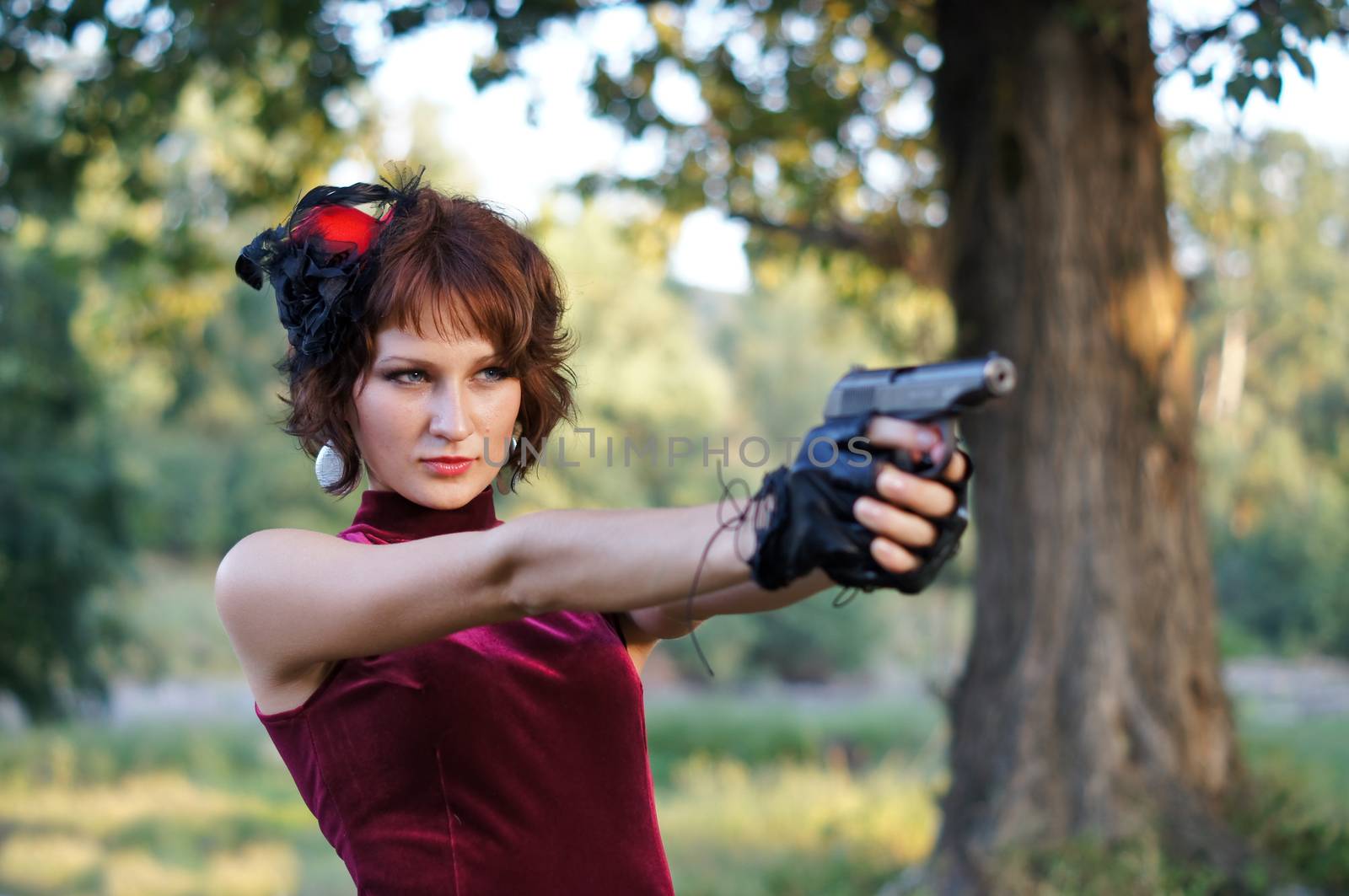 girl with gun on nature