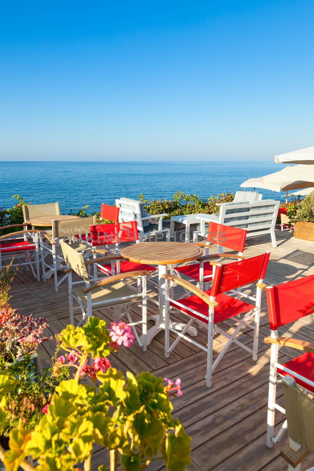 Seaside cafe terrace by naumoid