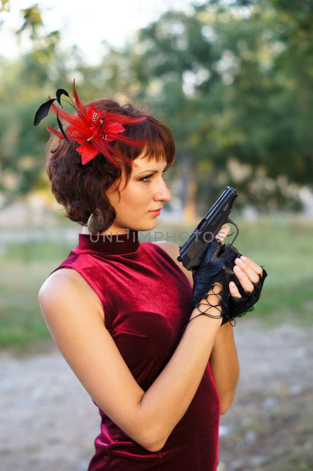 girl with gun on nature