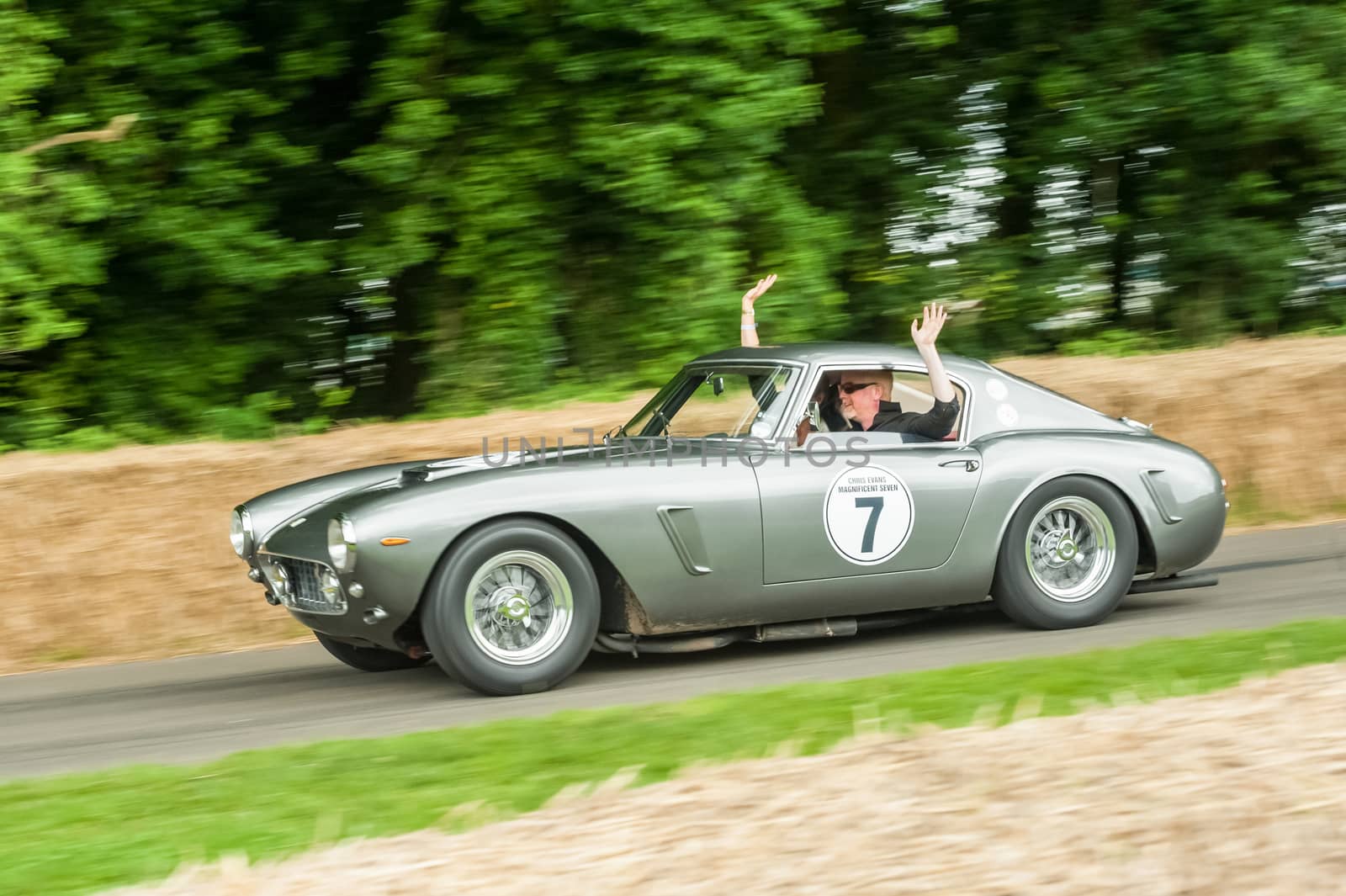 Goodwood, UK - July 1, 2012: British TV and radio personality Chris Evans driving a classic Ferrari 250 SWB the hill course at Goodwood, UK
