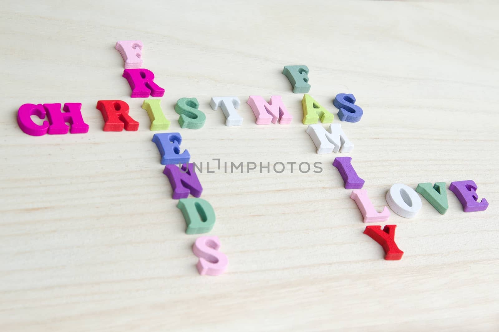 Photo shows a detail of the crossword puzzle funny sign with symbols on a table.