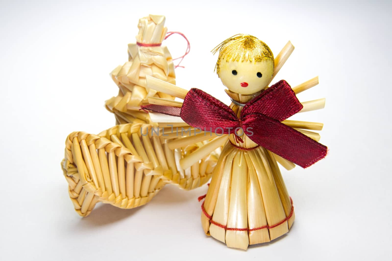 Photo shows closeup details of Christmas angel with presents.