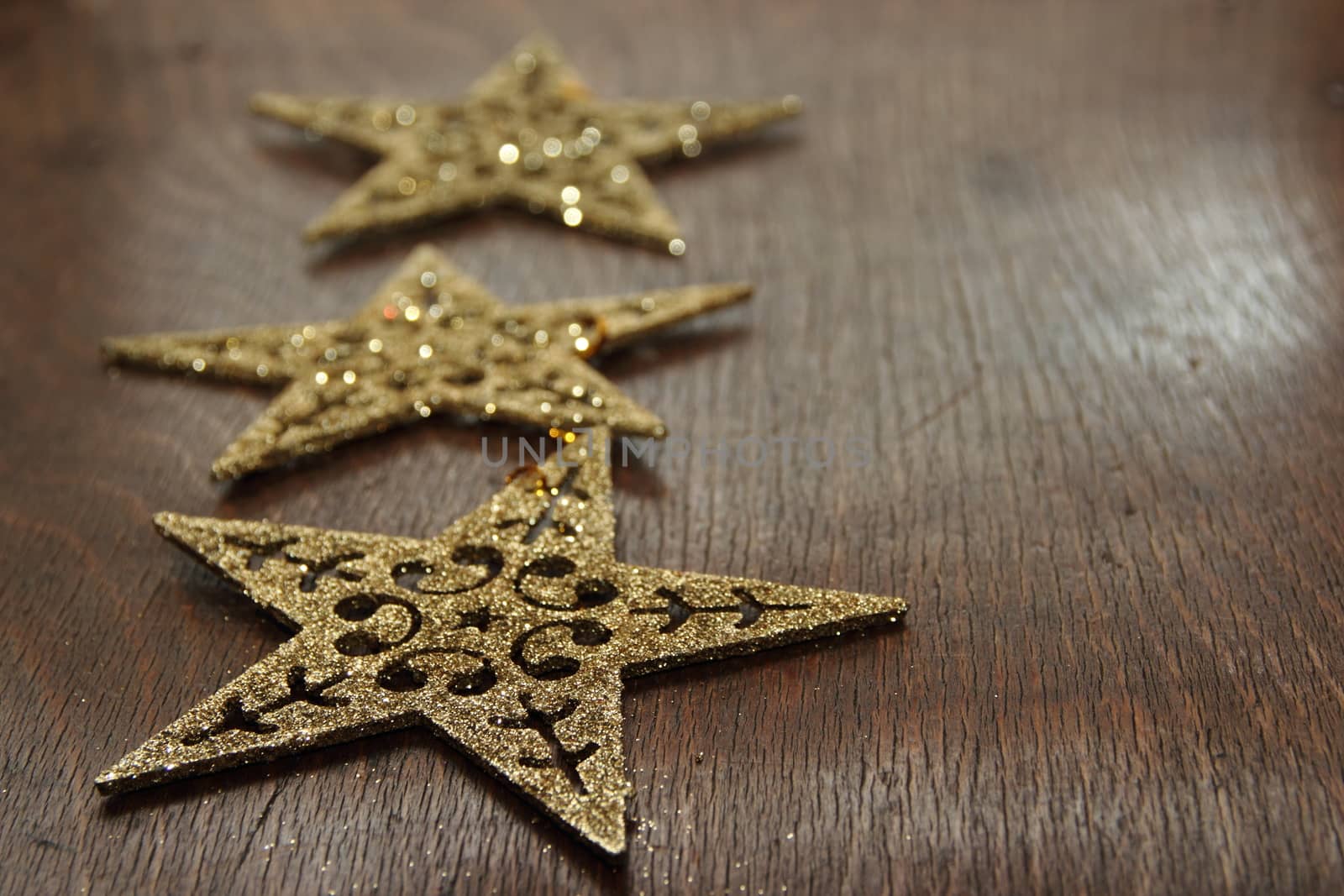 Christmas decorations.  three stars on wooden background