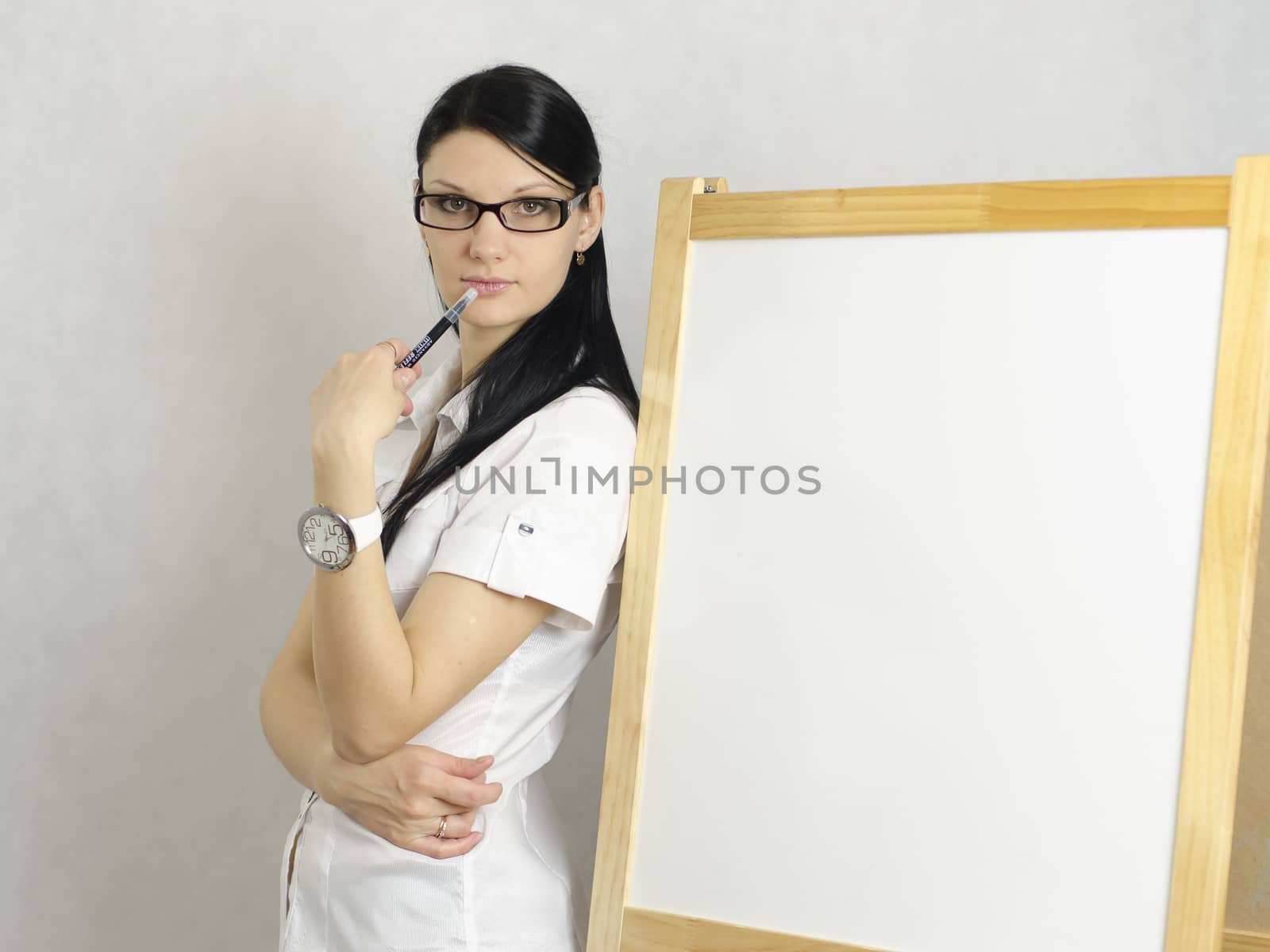 Working Girl thoughtfully her back to the white board
