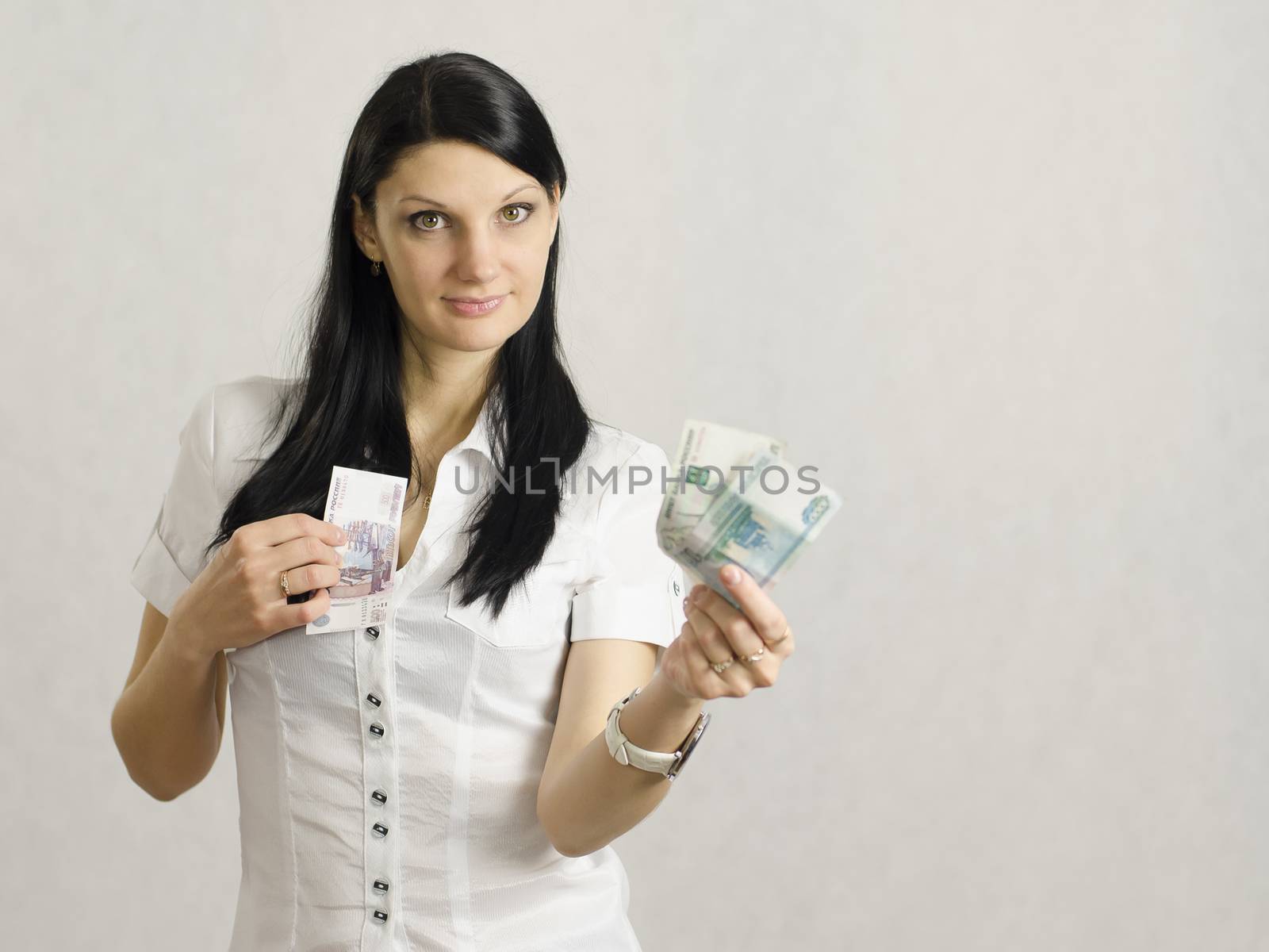 She holds out one hand forward two of the notes, the second one hand the bill to cuddle. There is a place for labels and advertising