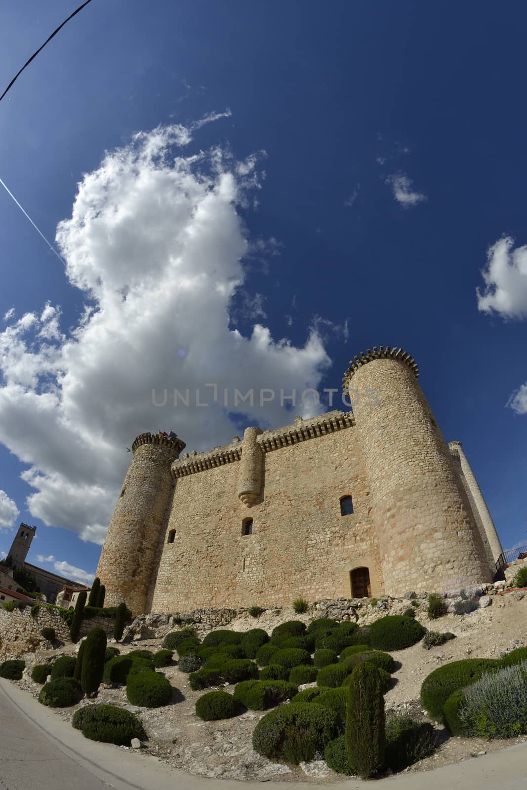 Torija castle through a fisheye lens. Spain. Sunny day with a few clouds in spring.