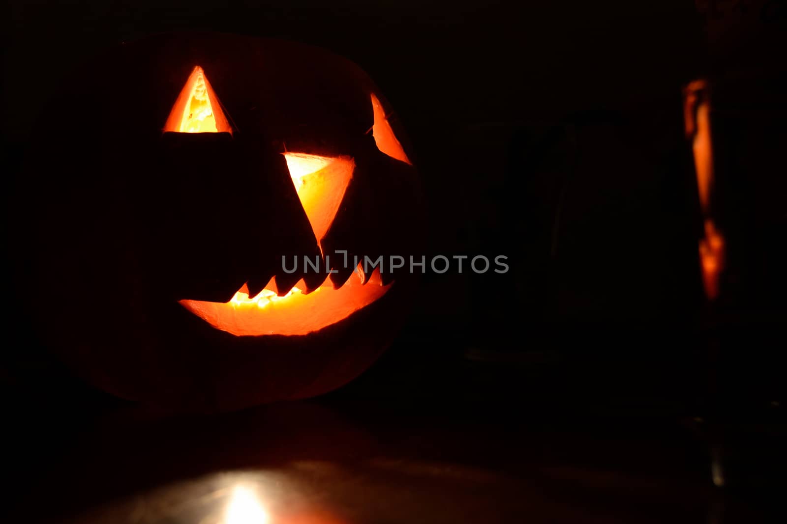 Halloween pumpkin lighted with a candle