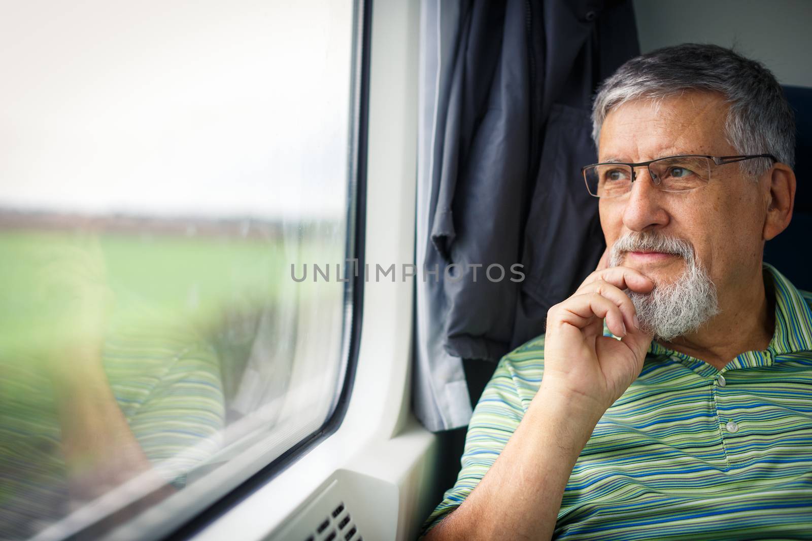 Senior man enjoying a train travel by viktor_cap