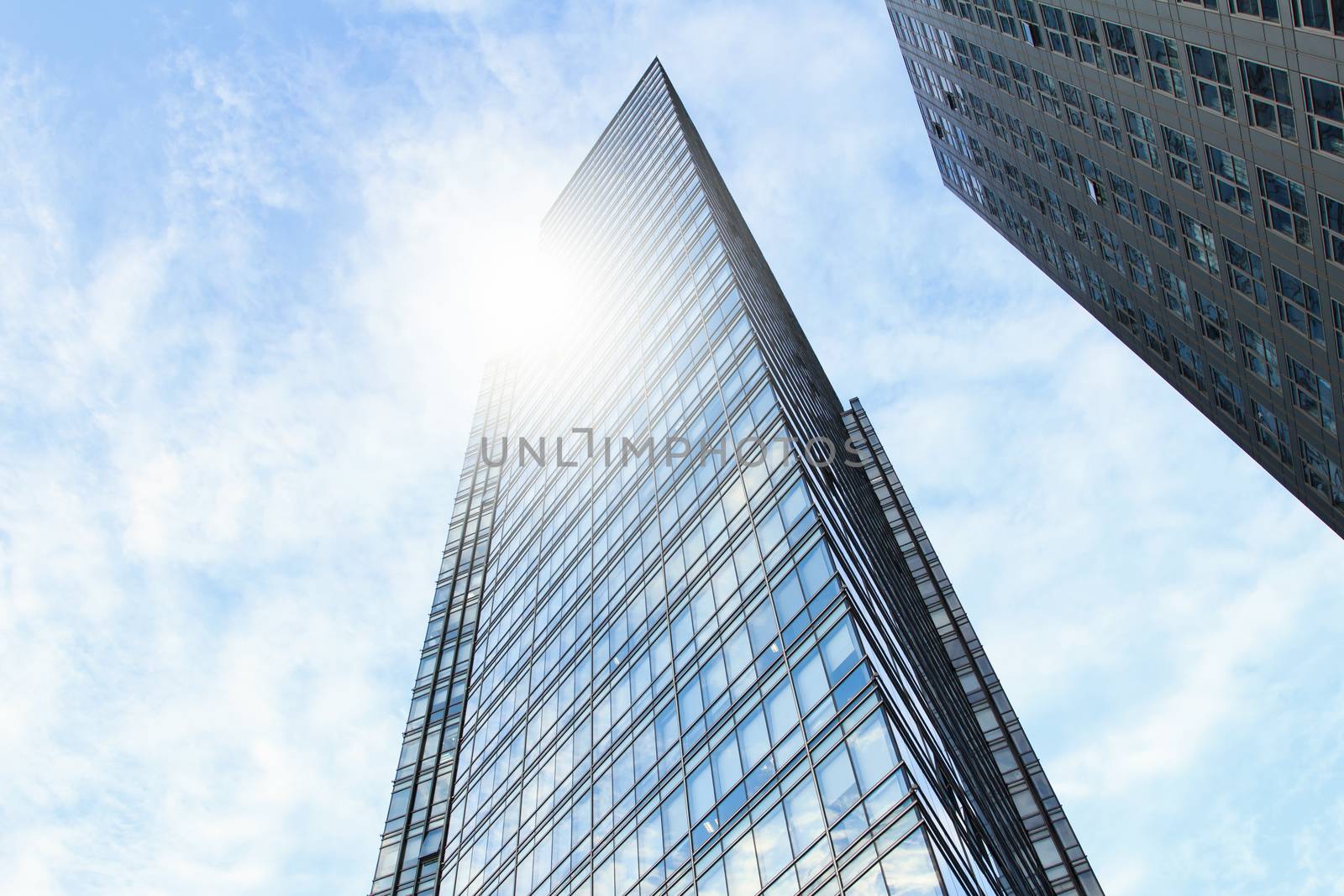 glass wall of office building,with reflection of clouds