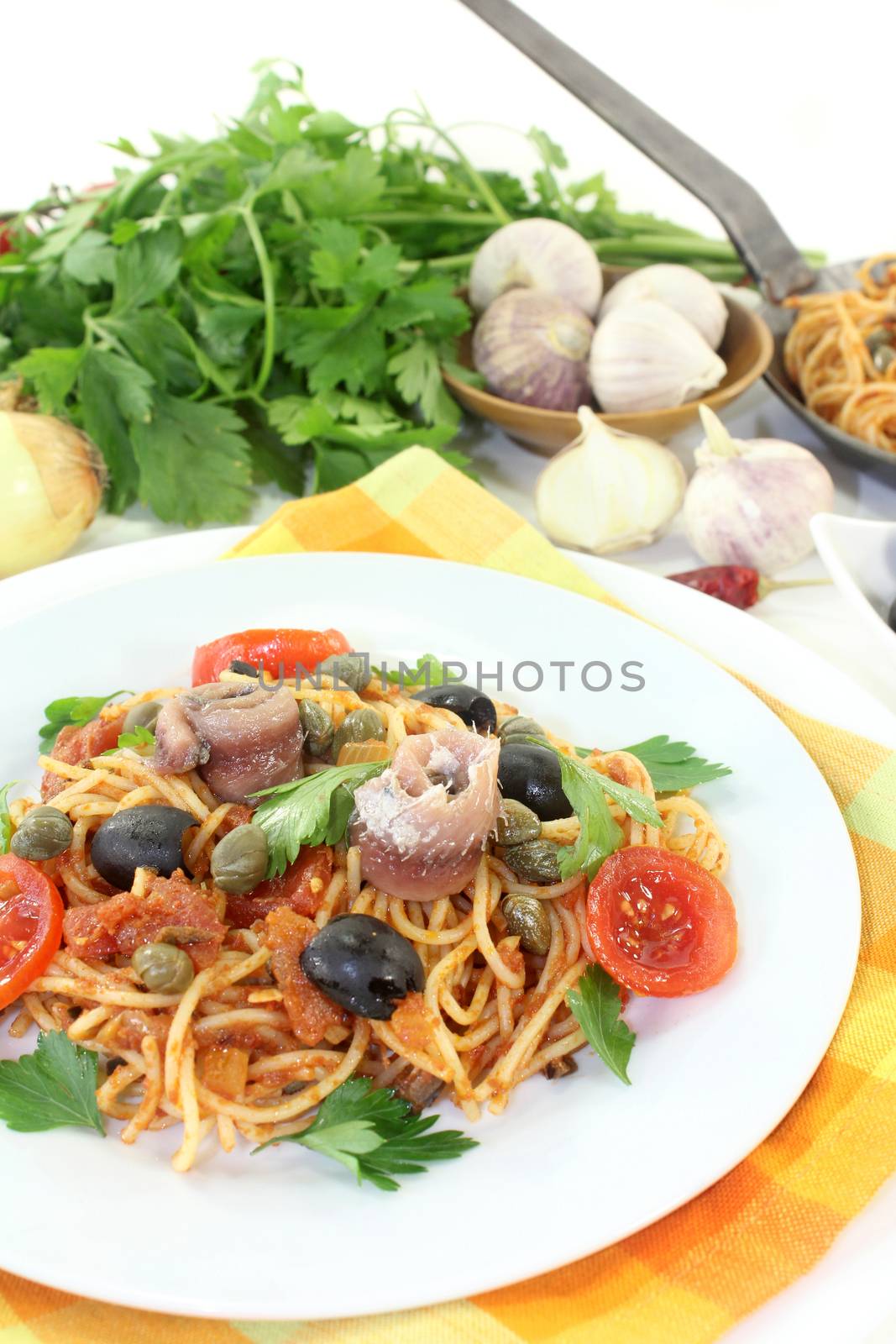 Capellini with tomatoes, anchovies, capers and olives