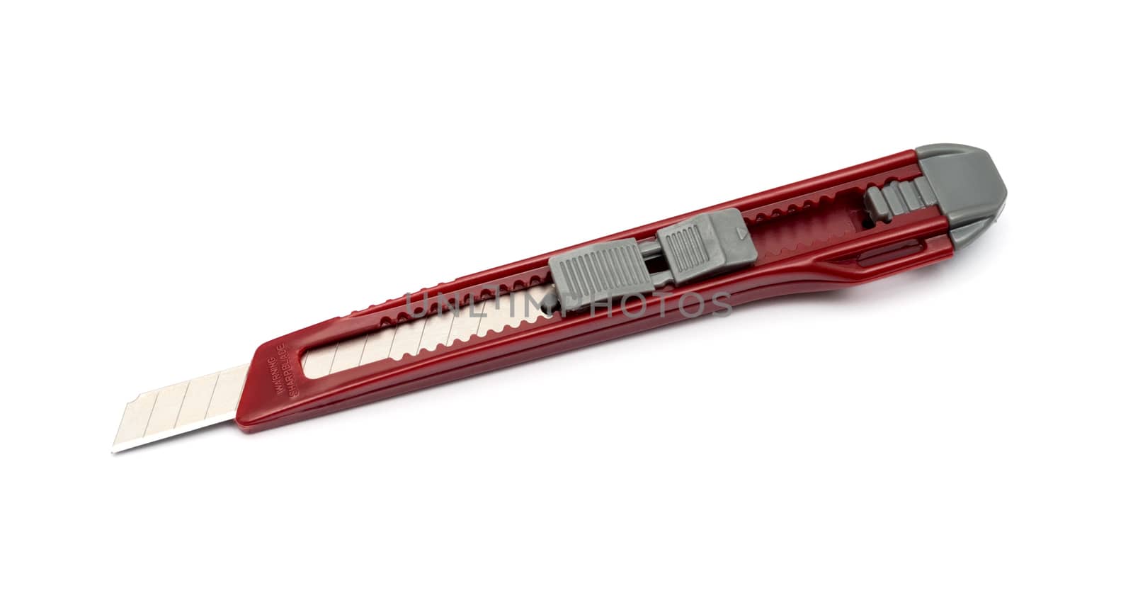 Red paper knife isolated on white background