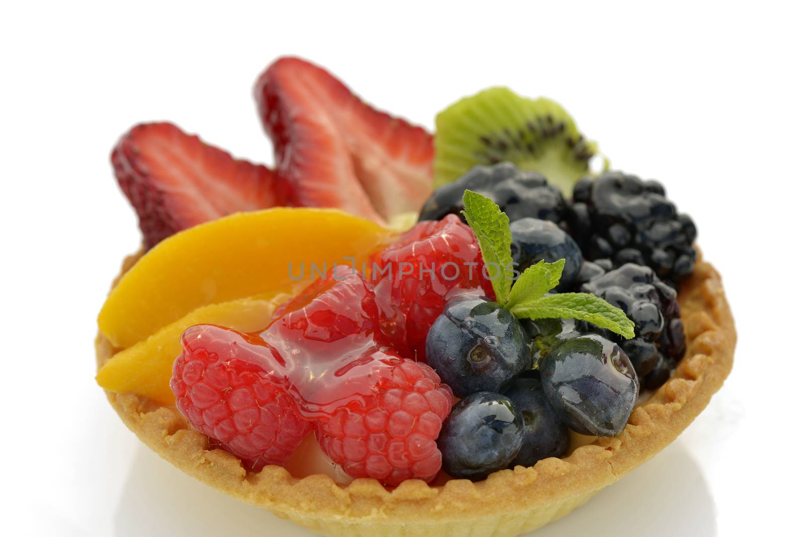 Clos-up of  blueberry, strawberry, apricot, kiwi and raspberry tartlet