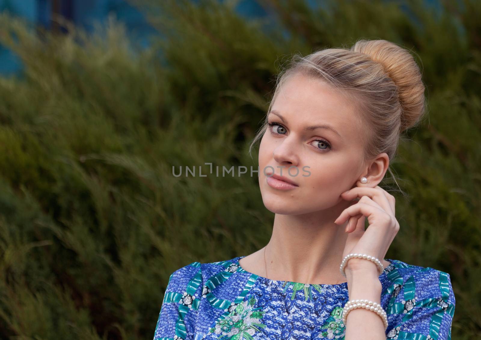 Young girl blonde on simple background by fotooxotnik