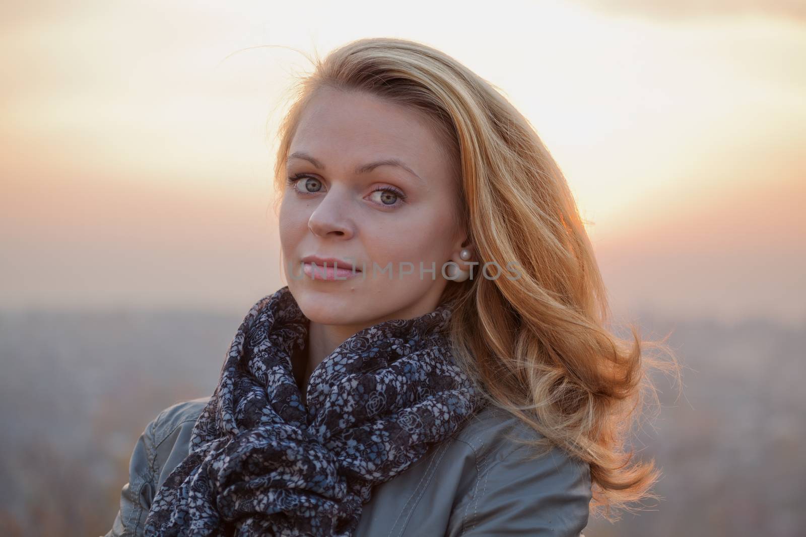 Young girl blonde on simple light background
