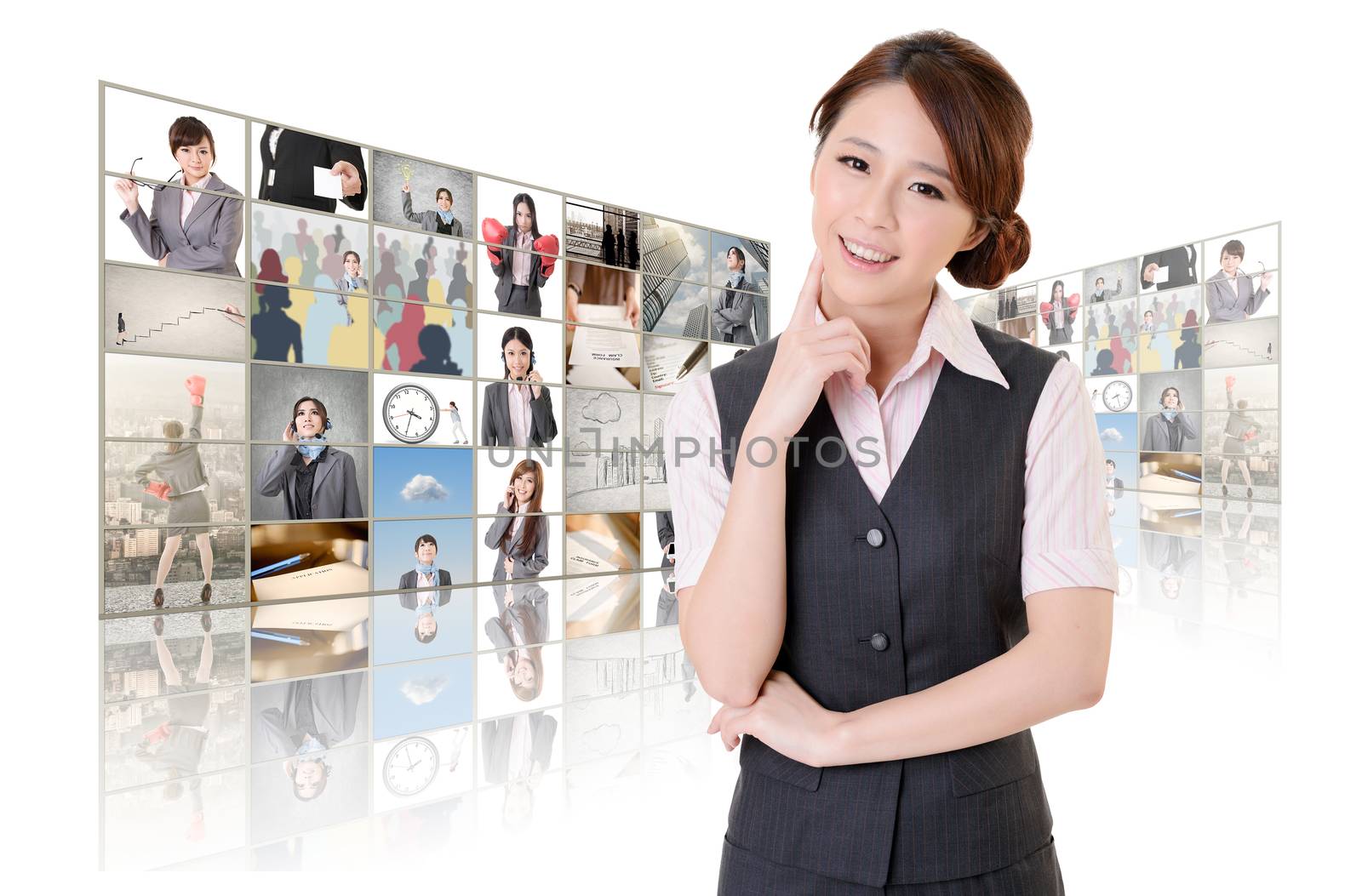 Attractive Asian business woman standing in front of TV screen wall, closeup portrait.