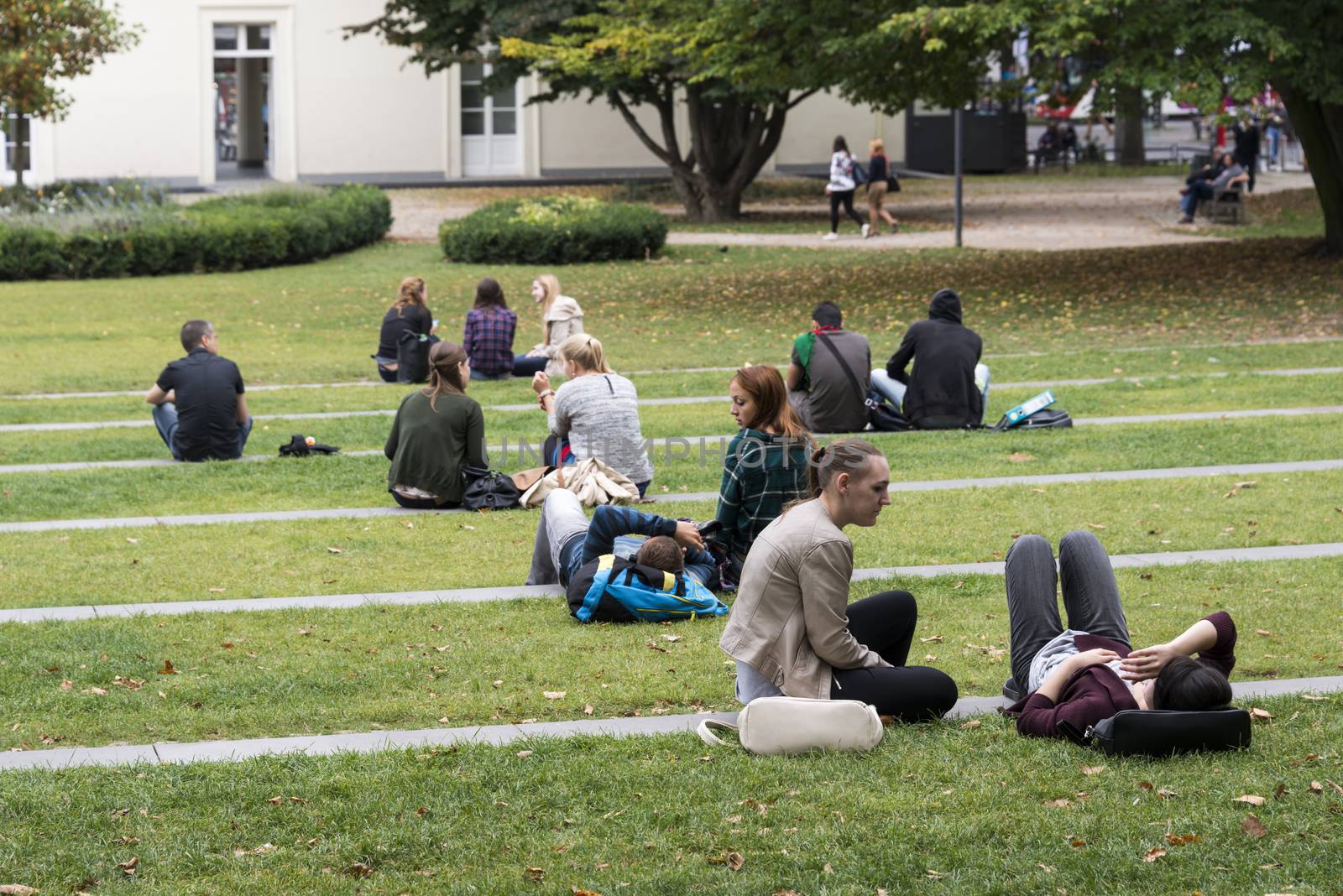 young people relax in the park on summer day
