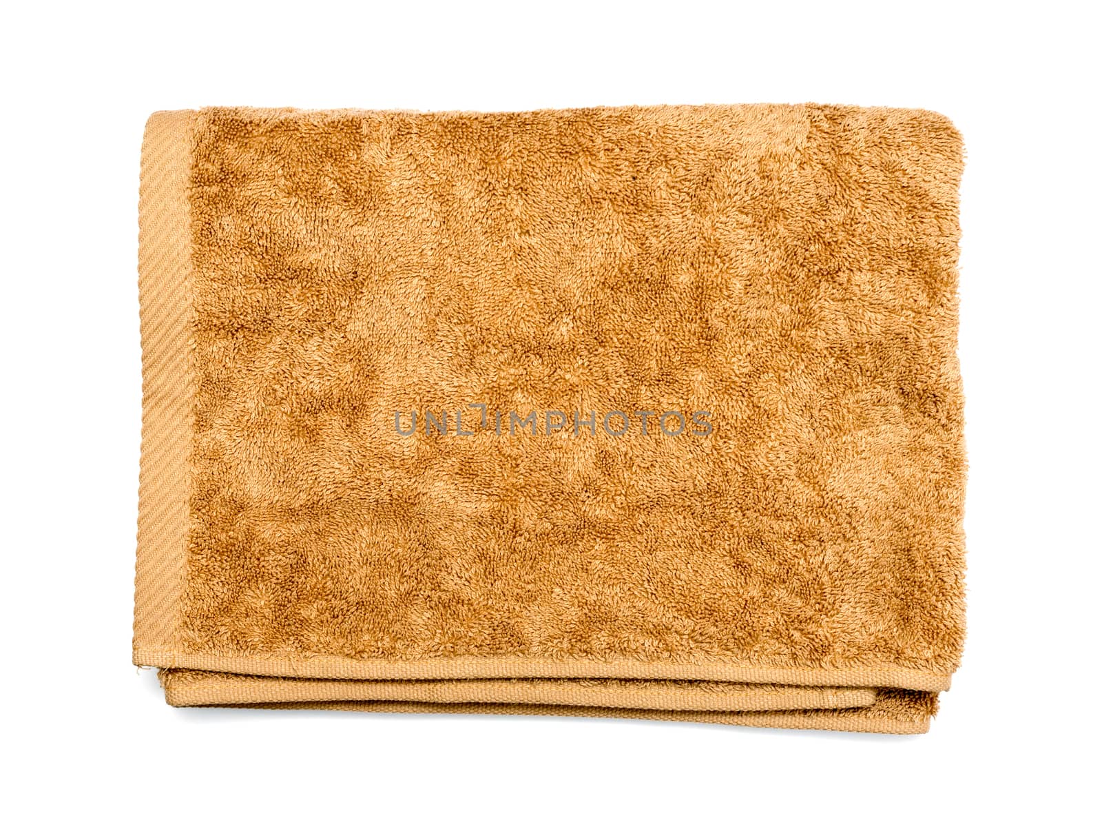 Light brown folded towel on white