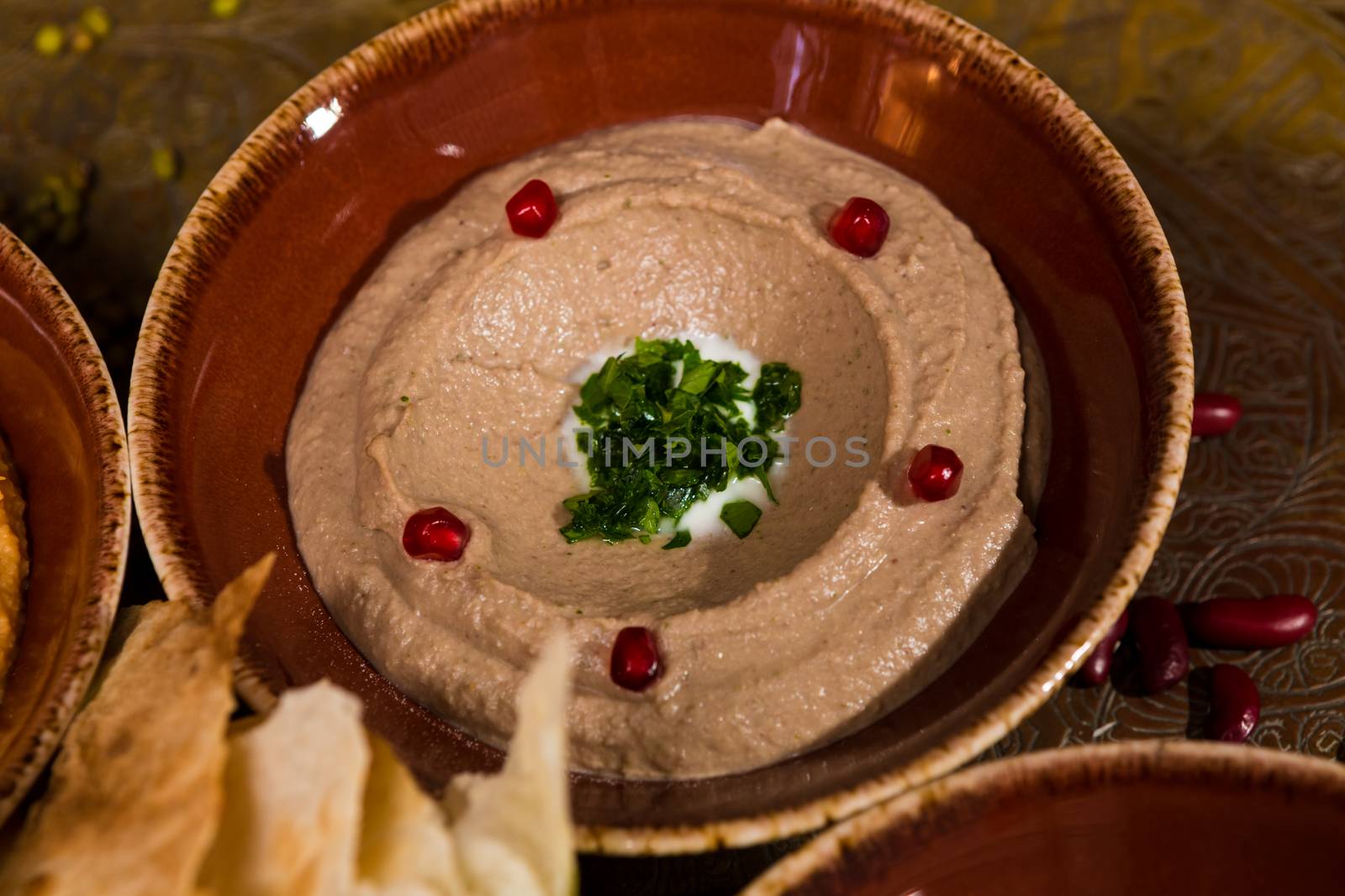 bowl of creamy hummus by sarymsakov