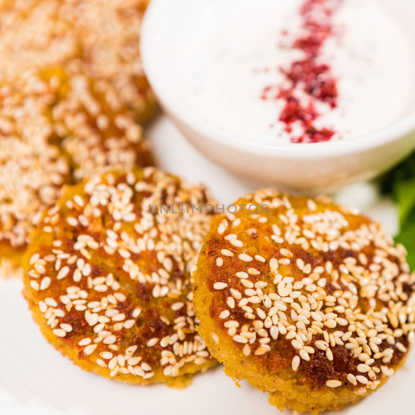 Middle East cuisine. a plate of delicious falafels and hummus. Vegetarian fare.