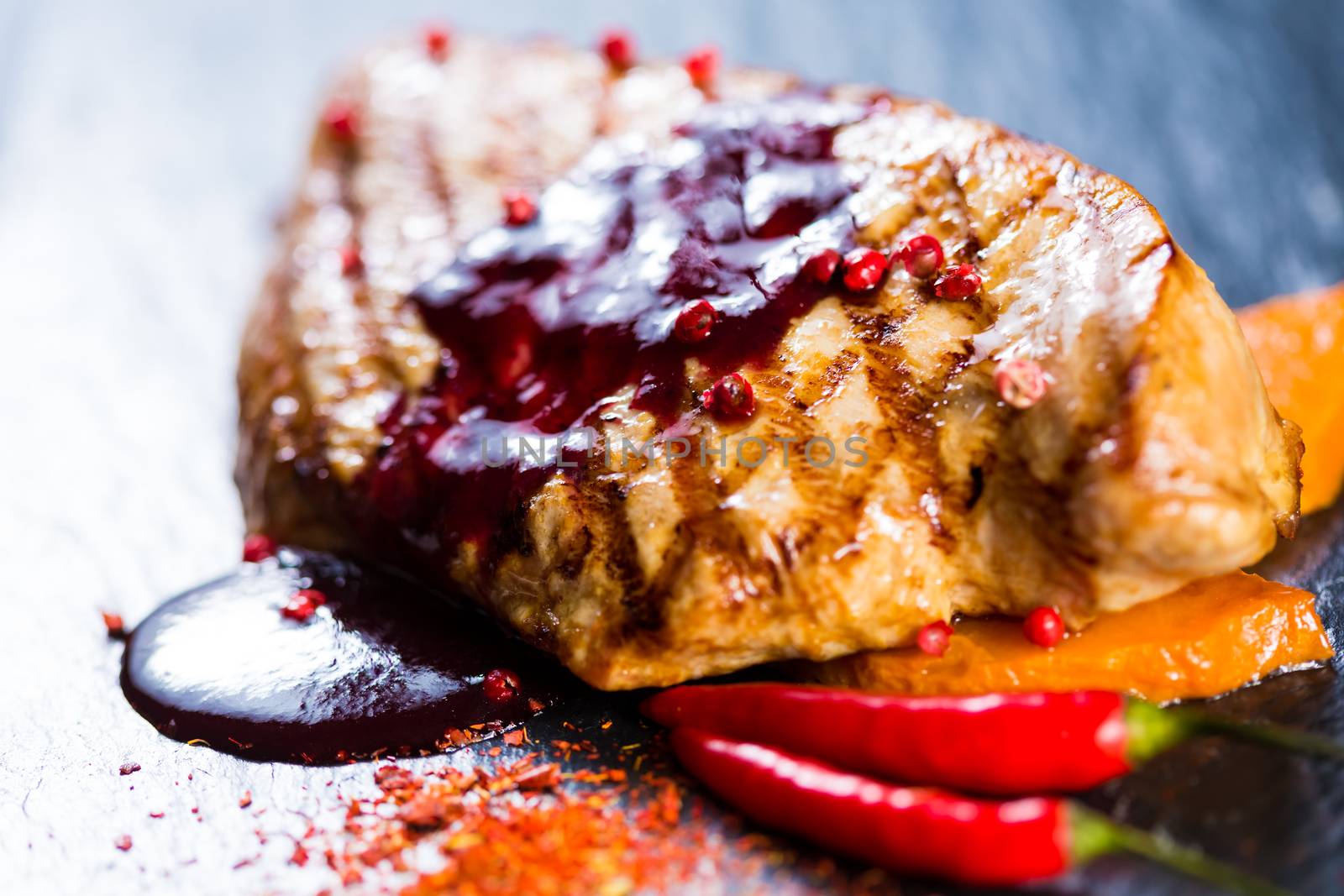 Deer steak with cranberries sauce. Selective focus.