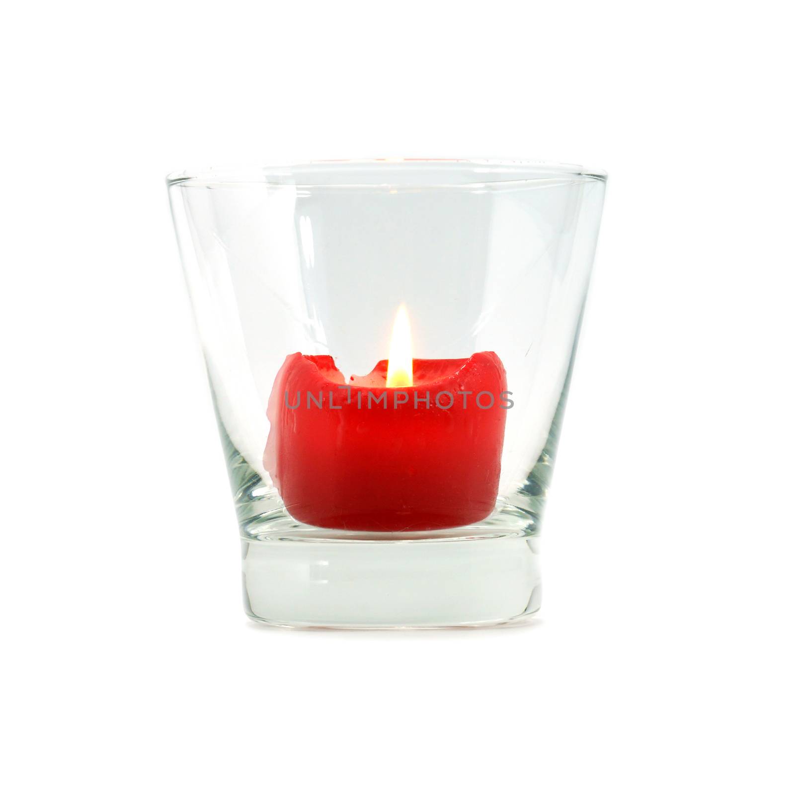 Red candles in glass tableware. by Noppharat_th