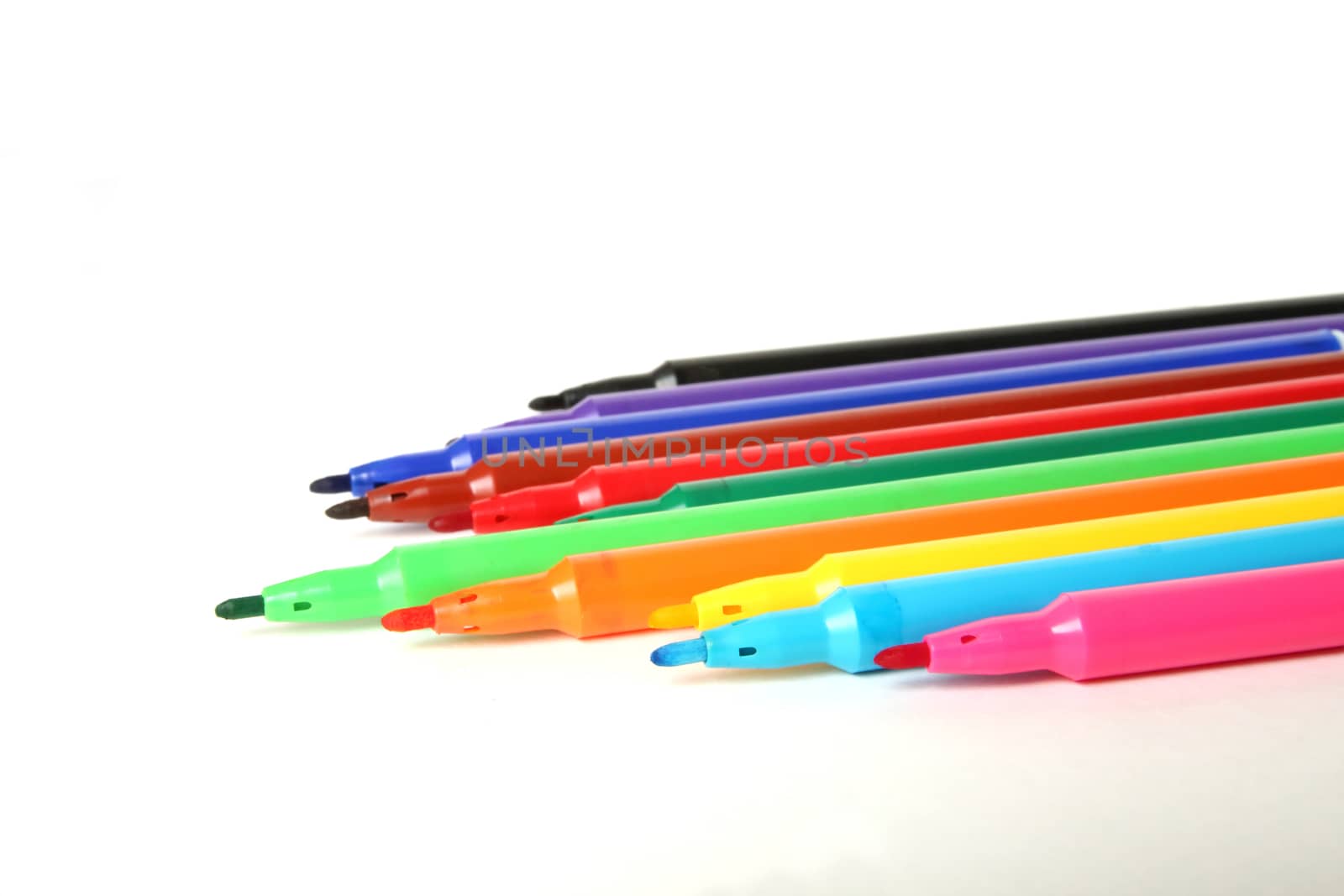 Twelve color marker pens on white background.
