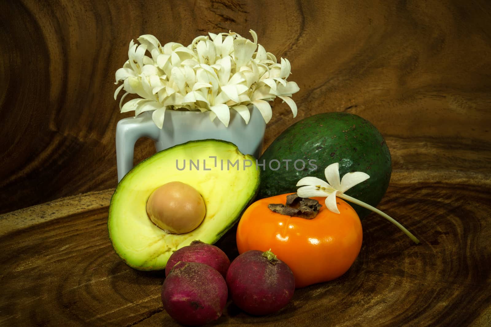 Vegetables and fruits on wooden background. by Noppharat_th