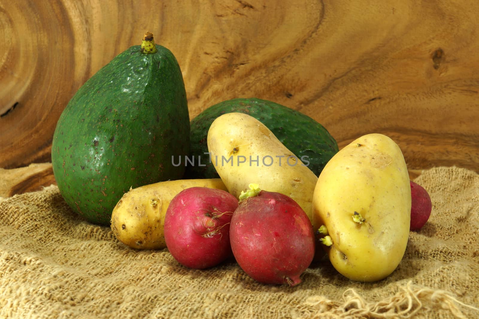 Vegetables and fruits on wooden background.