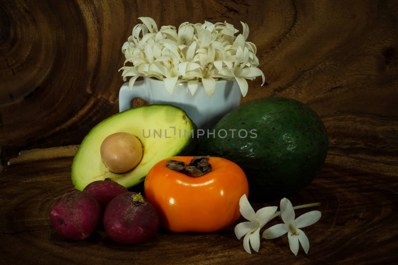 Vegetables and fruits on wooden background. by Noppharat_th