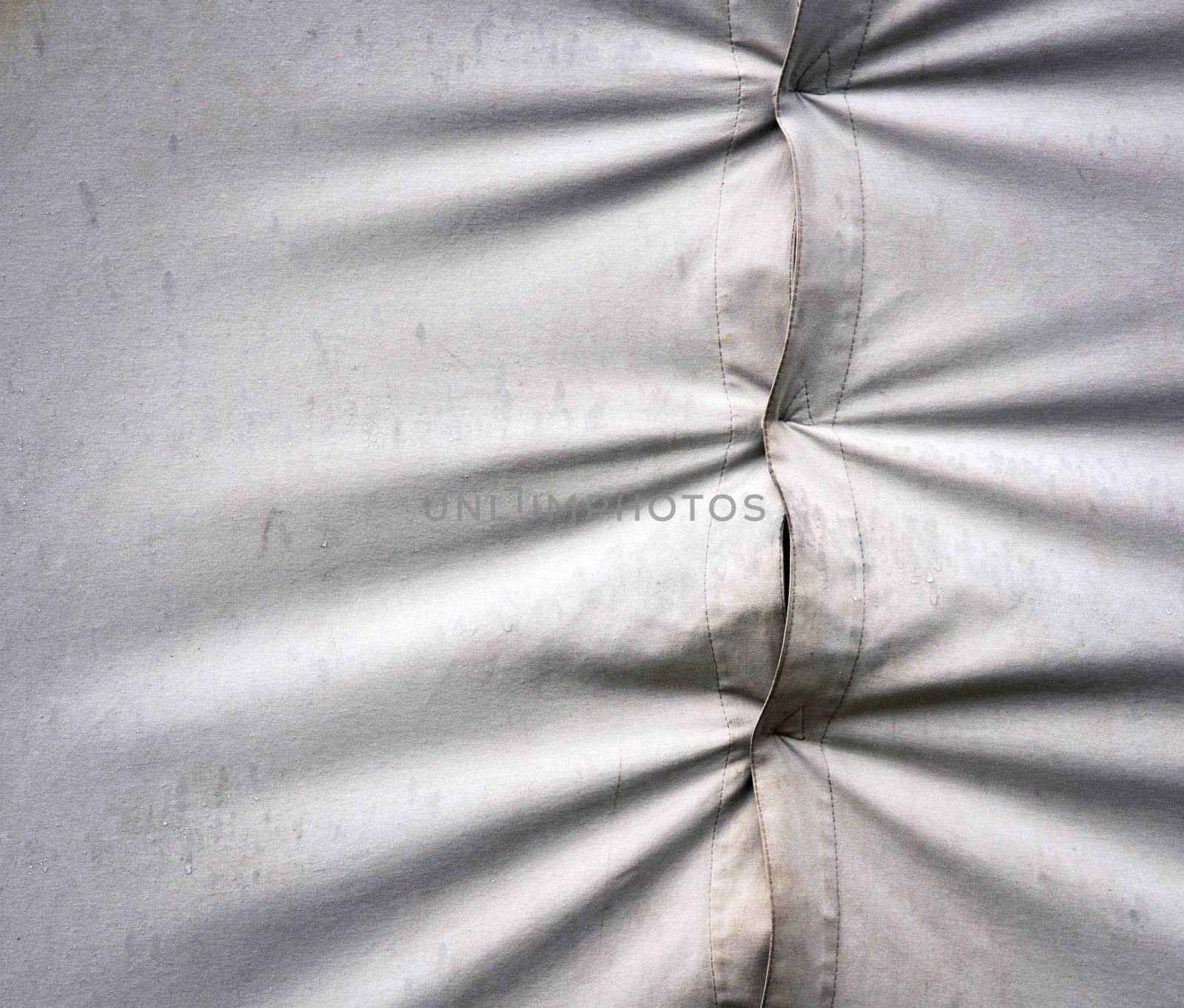 background or texture detail of an old canvas tent