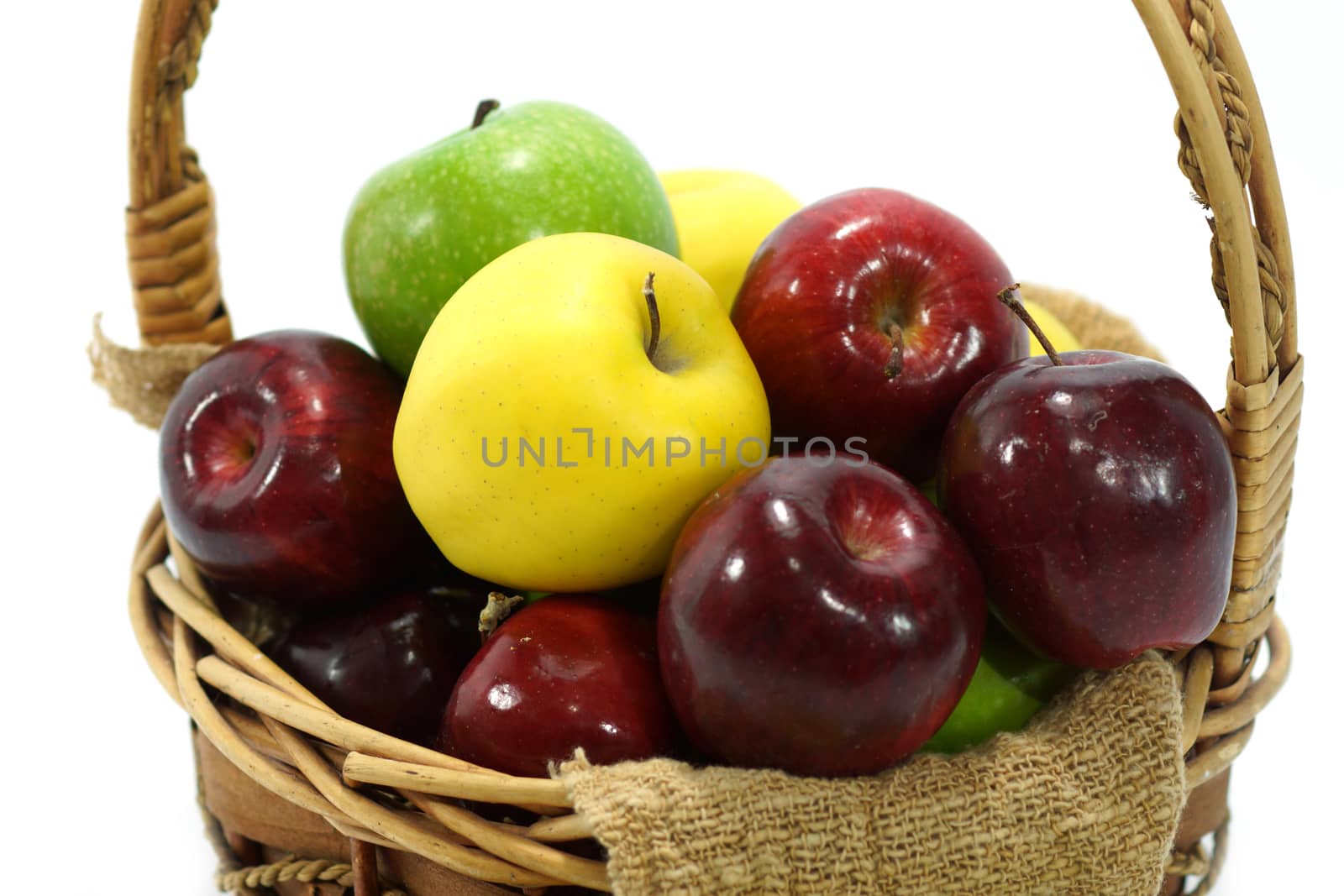 Apples in basket on a white background.