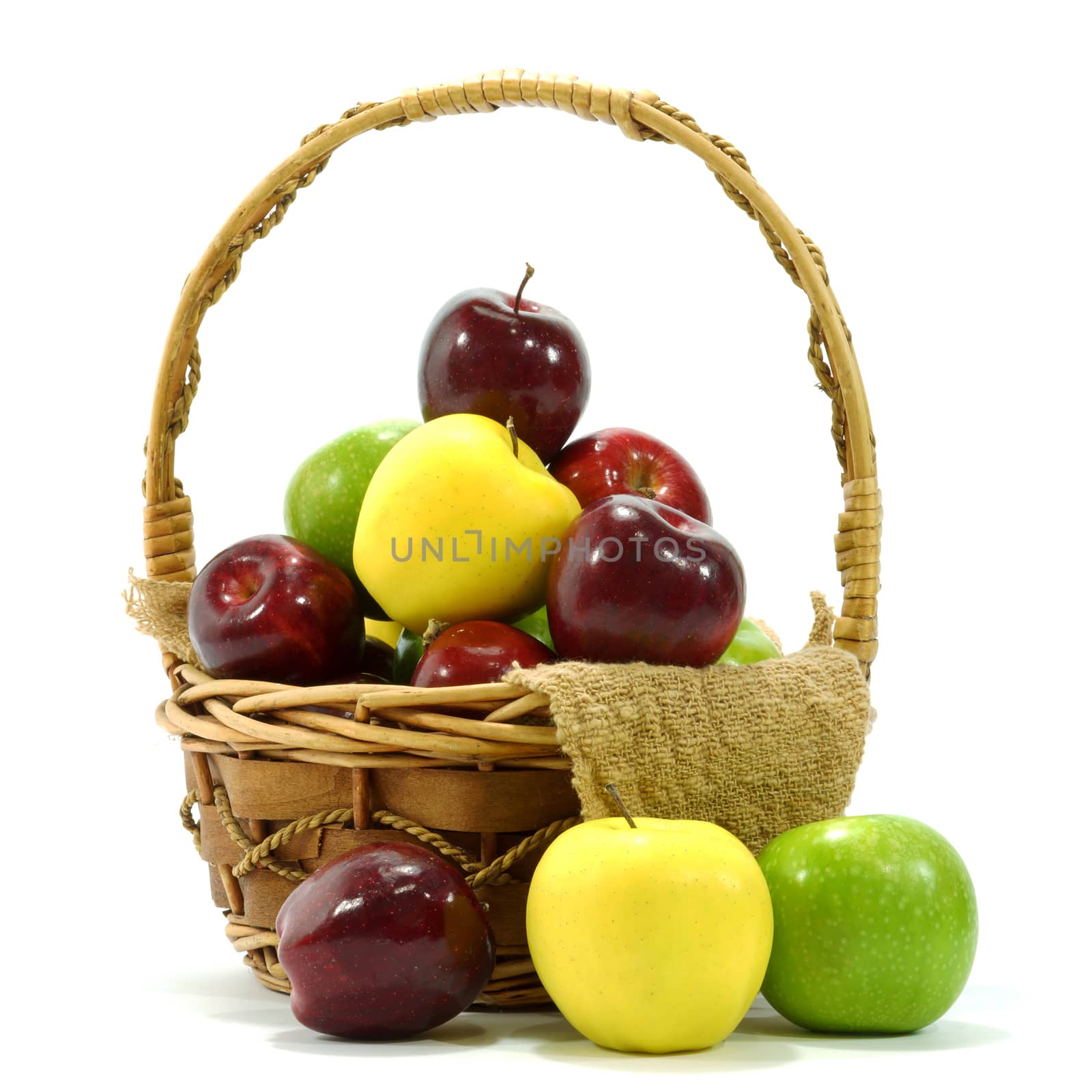 Apples in basket on a white background.