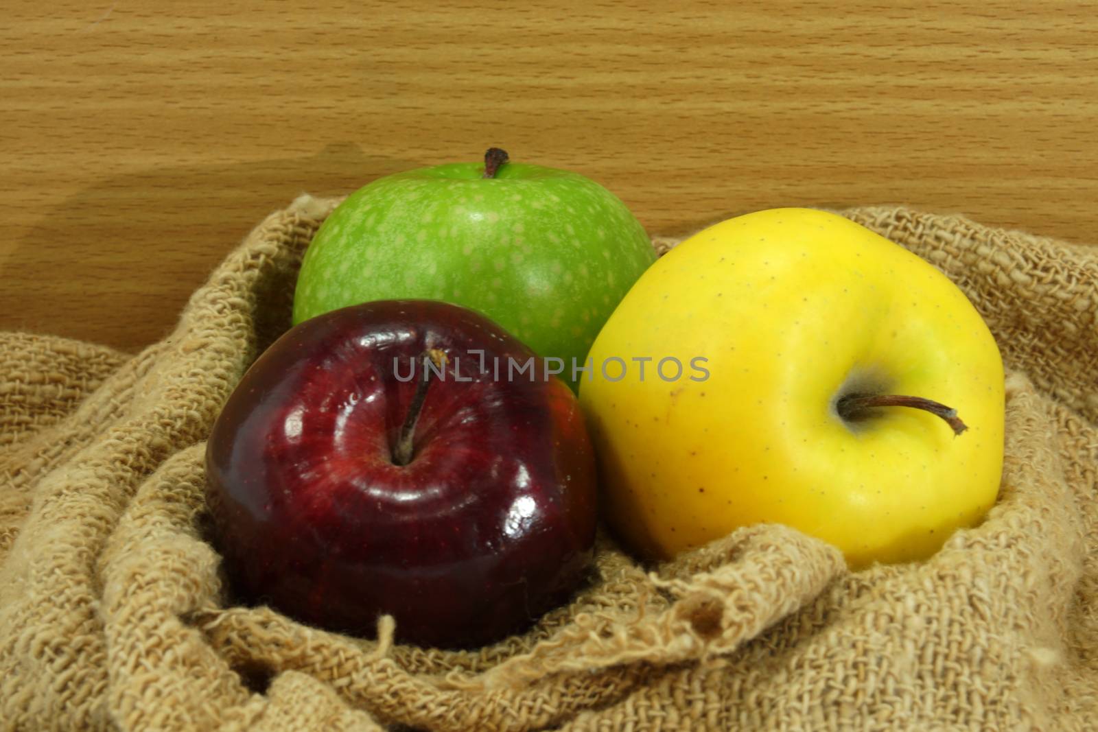Three color apple on fabric.