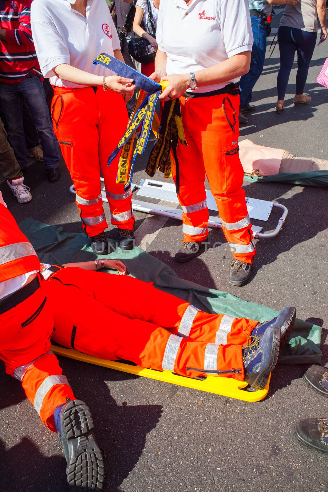 MILAN, ITALY - MAY, 18: Emergency personnel render aid to a girl during an emergency simulation on May 18, 2014