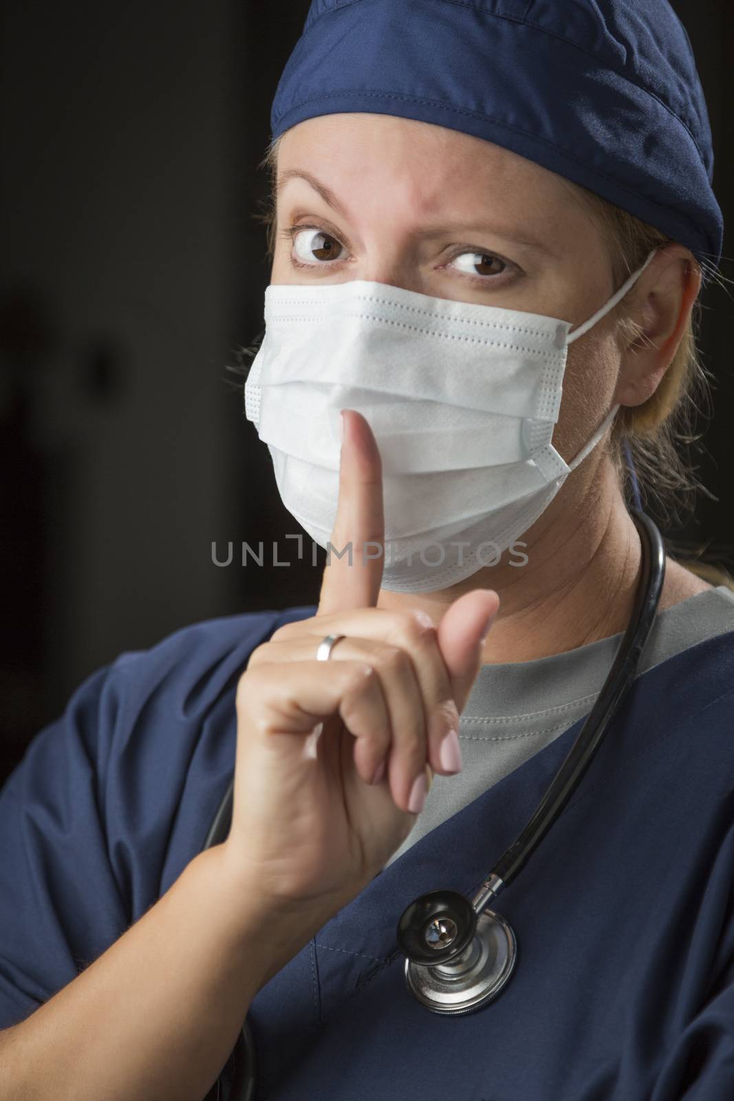 Secretive Female Doctor with Finger in Front of Mouth by Feverpitched