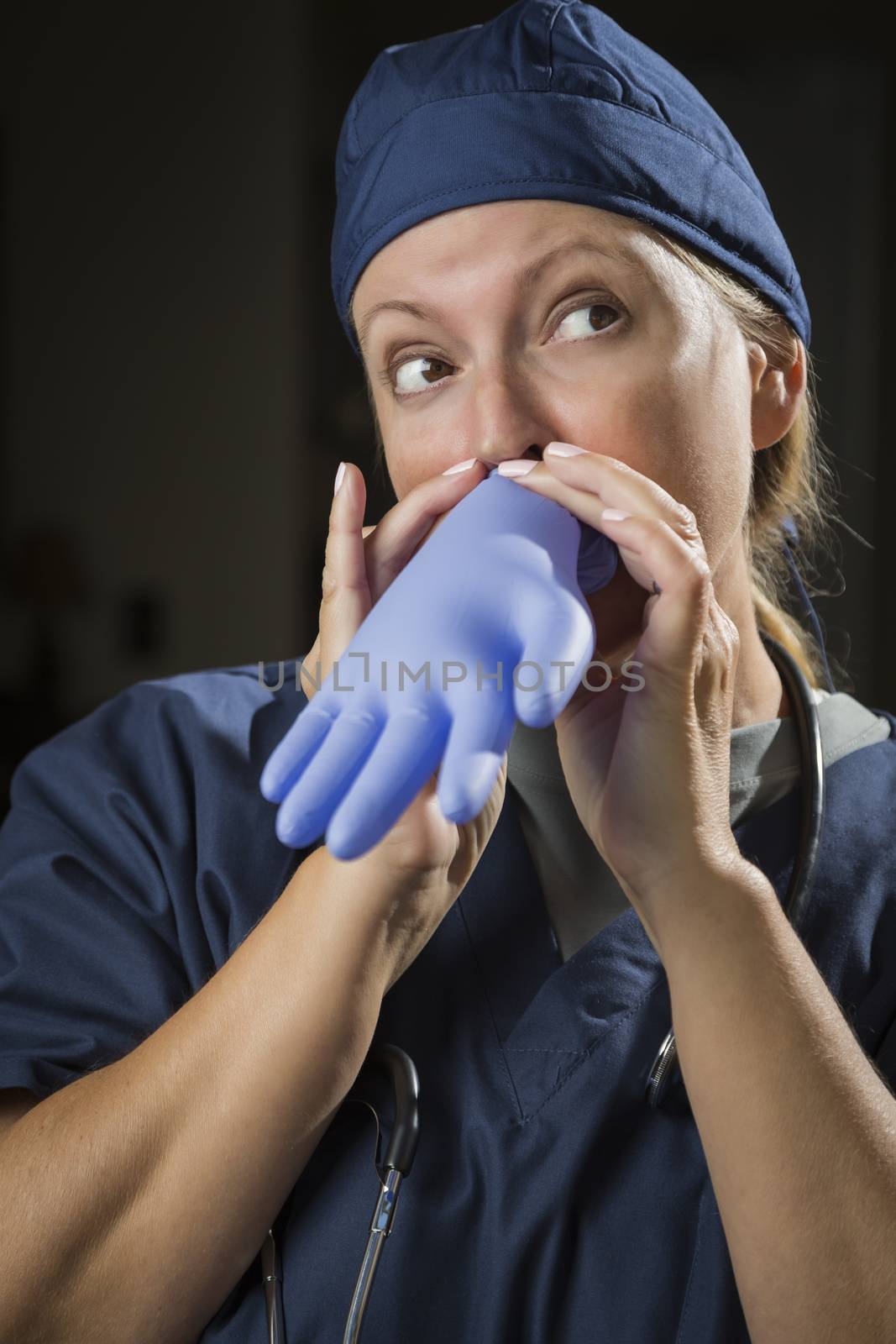 Playful Funny Doctor or Nurse Inflating Surgical Glove.