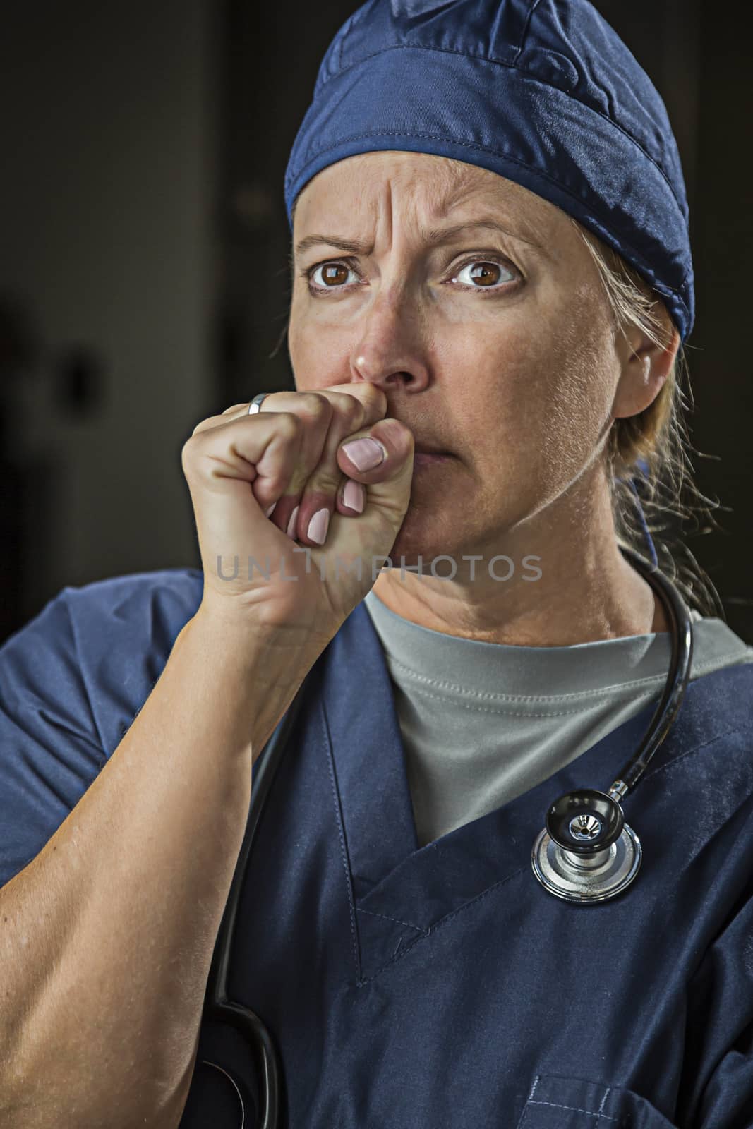 Very Concerned Looking Female Doctor or Nurse.
