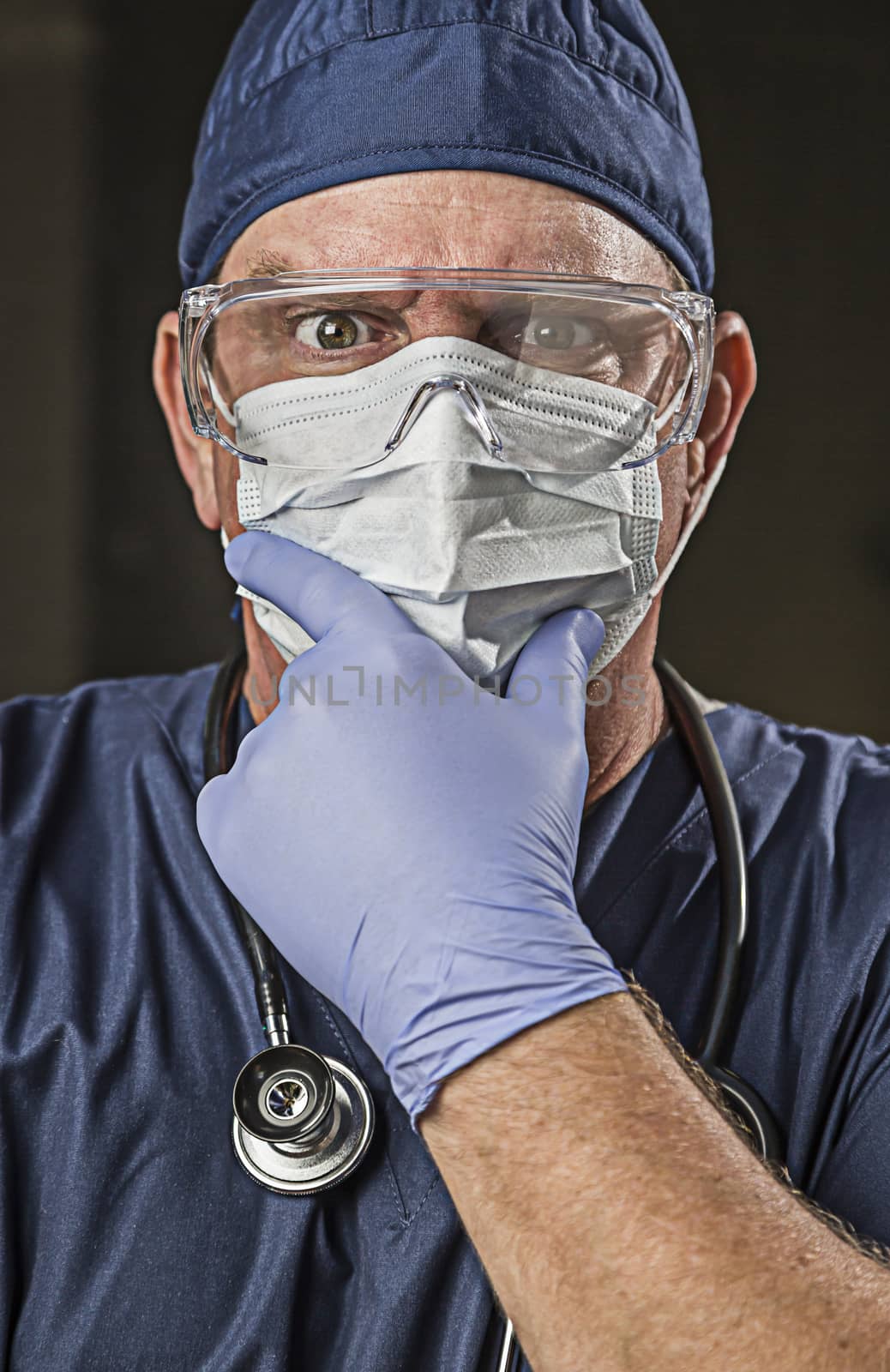 Determined Looking Doctor or Nurse with Protective Wear and Stet by Feverpitched