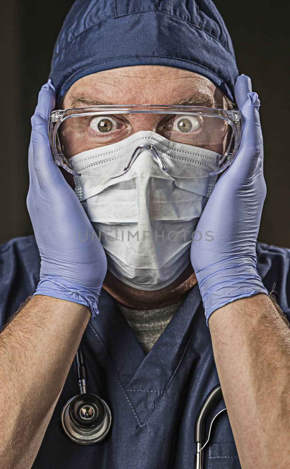 Stunned Male Doctor or Nurse with Protective Wear and Stethoscope.