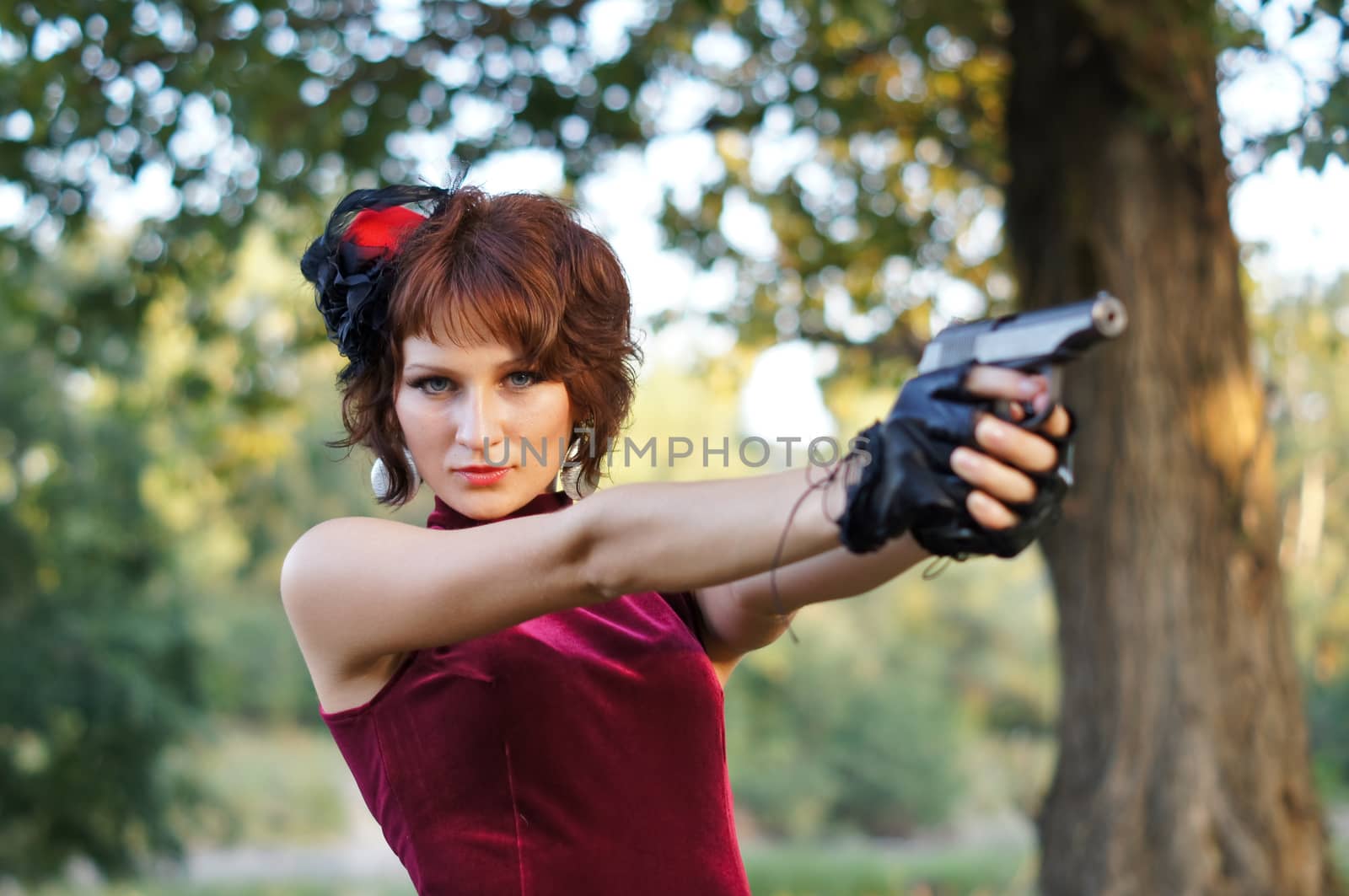 girl with gun on nature