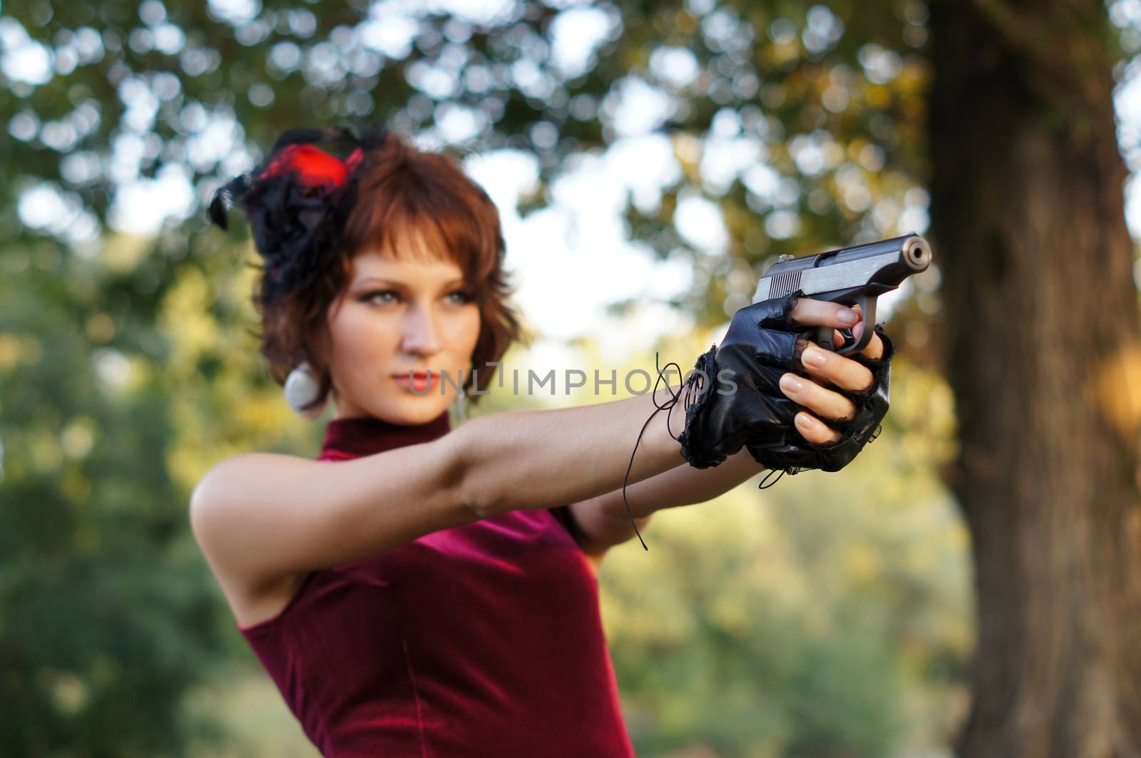 girl with gun on nature