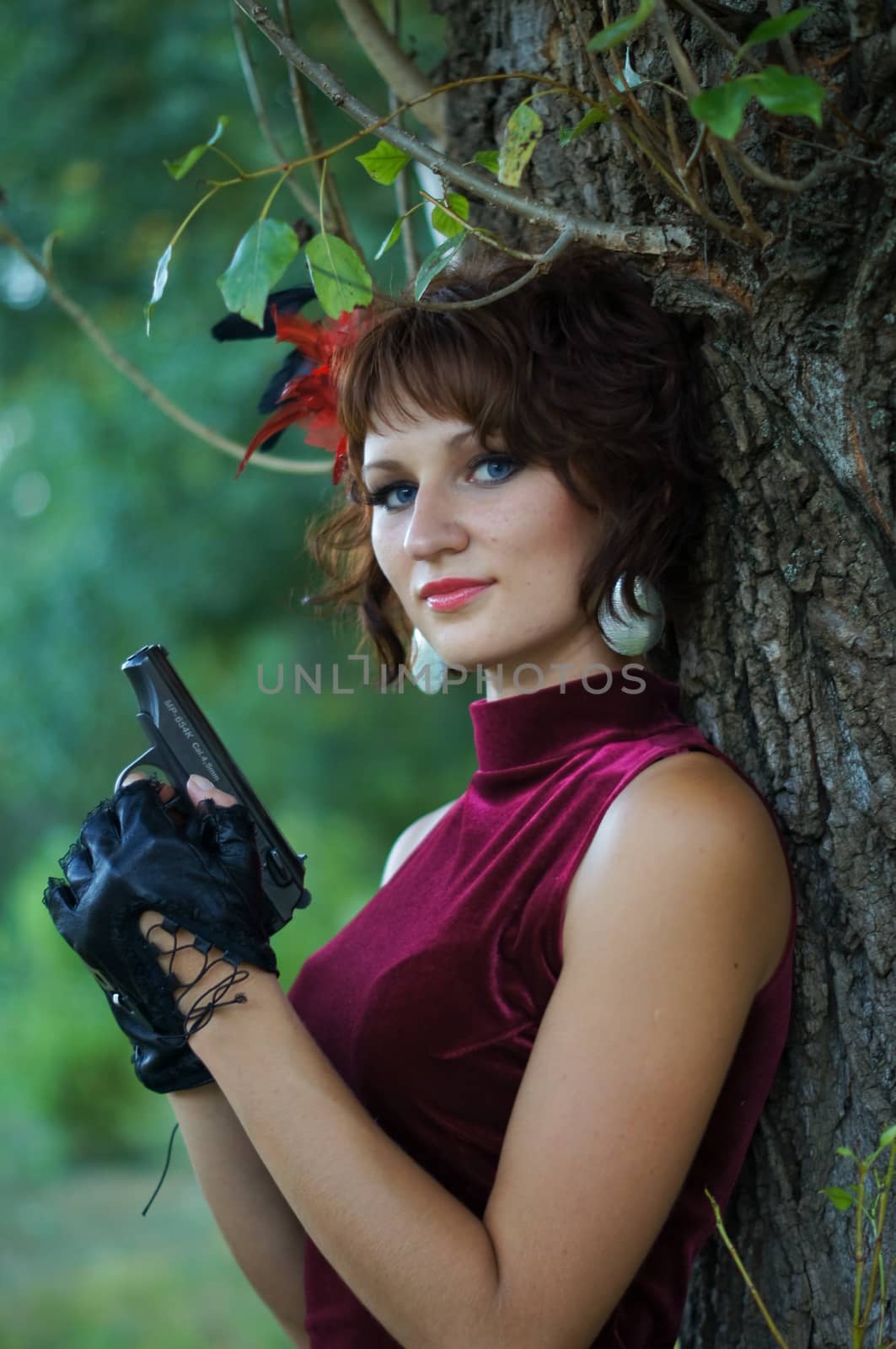 girl with gun on nature