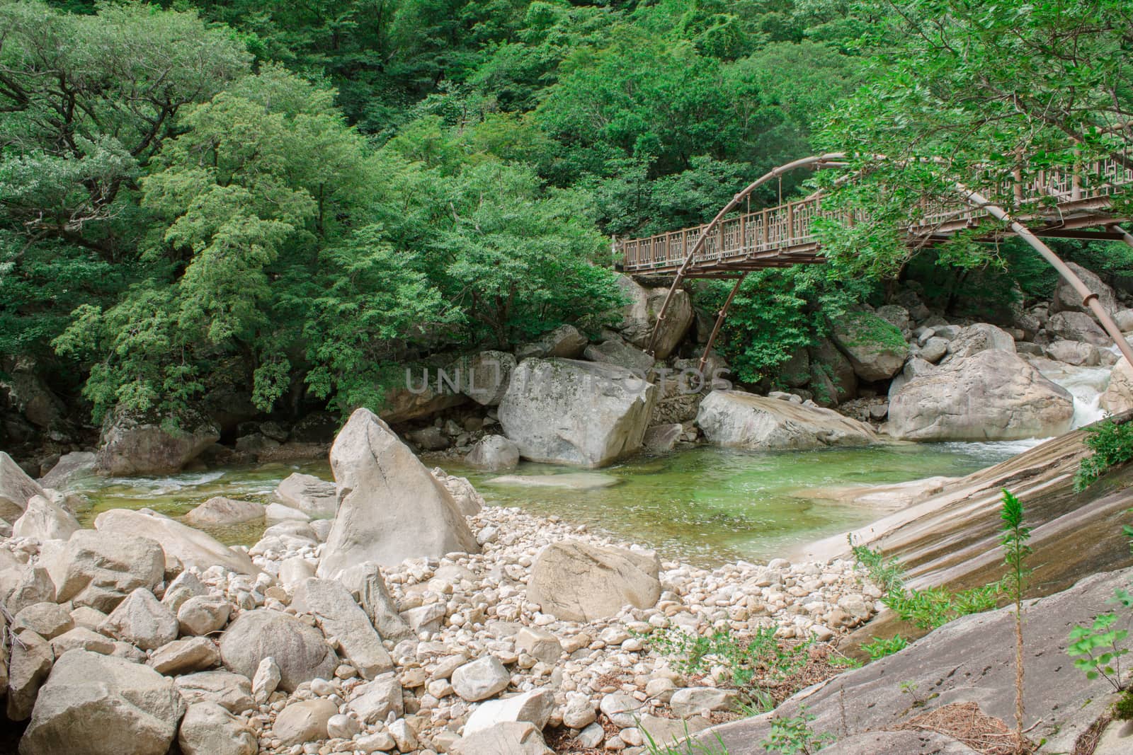 iron bridge over mountain river by Mieszko9