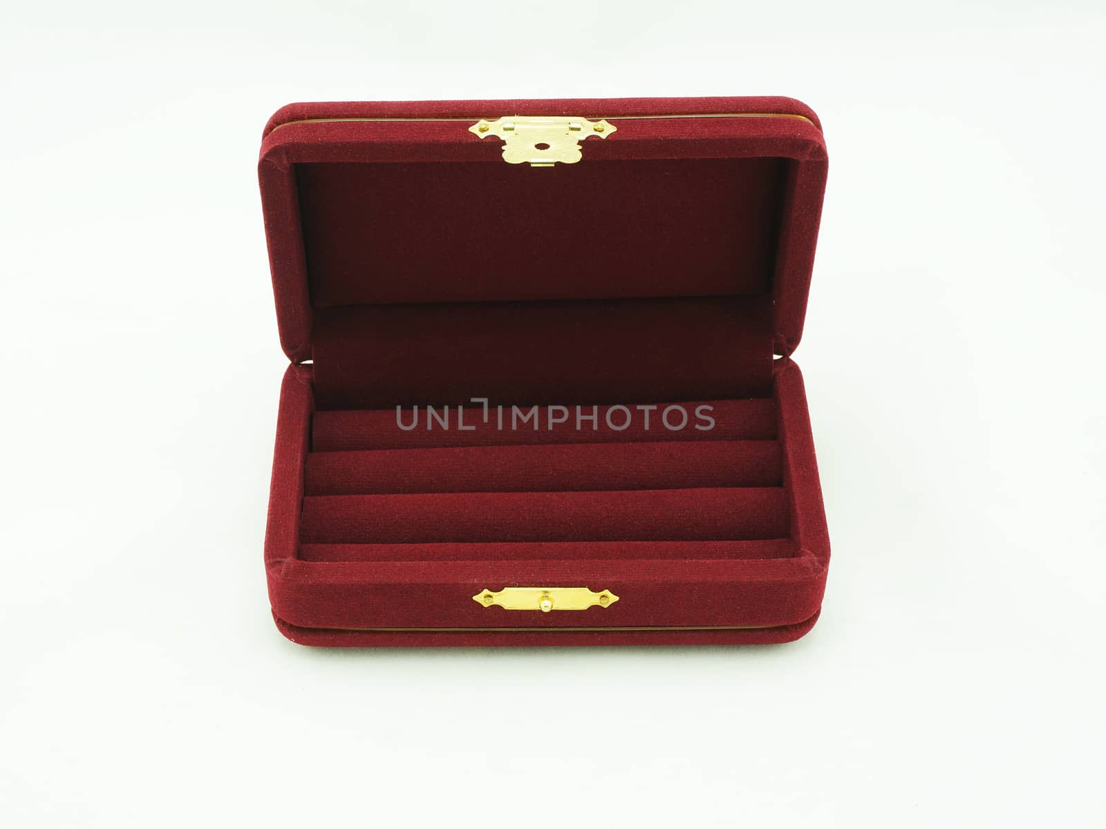 Red velvet box for the ring, isolated over the white background.                               