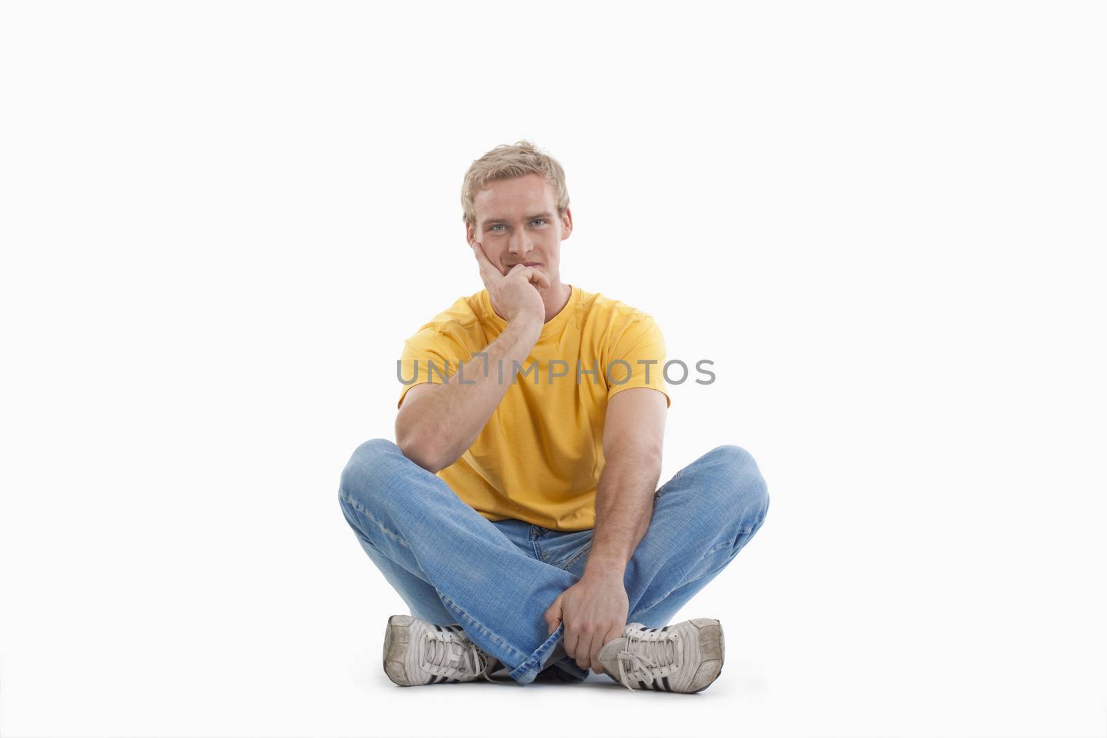 studio portrait of a young man - isolated on white