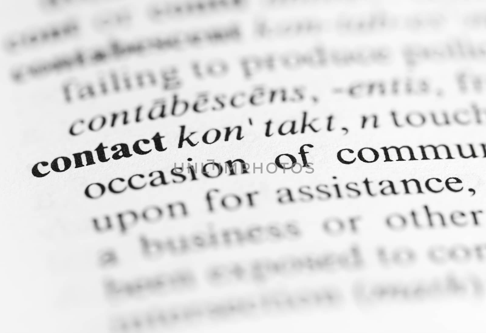 Close up of the word 'contact' and its definition in the dictionary