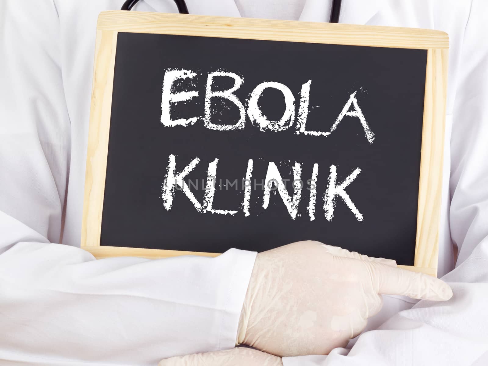 Doctor shows information: Ebola clinic in german language by gwolters